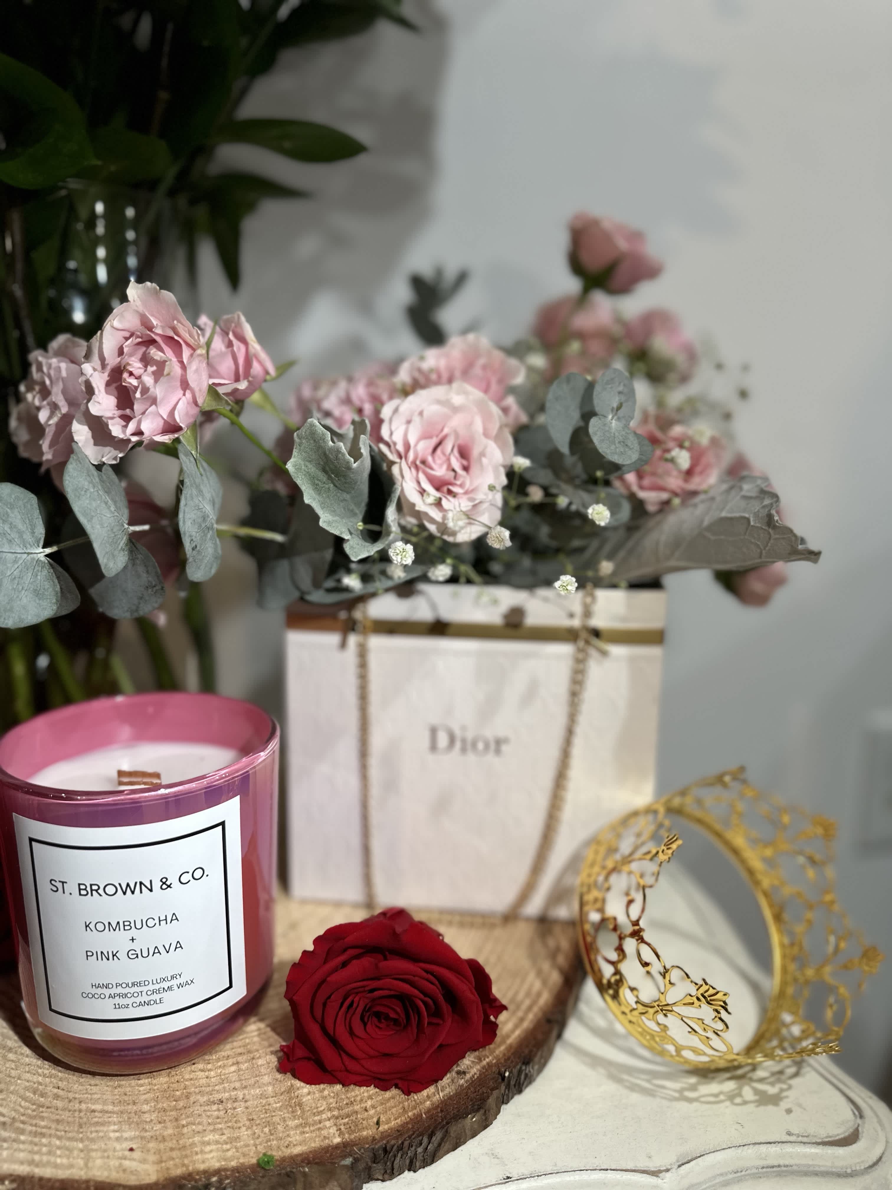 Dior Purse Arrangement Dior Purse Arrangement - A luxurious arrangement of six roses curated in a Dior inspired purse.