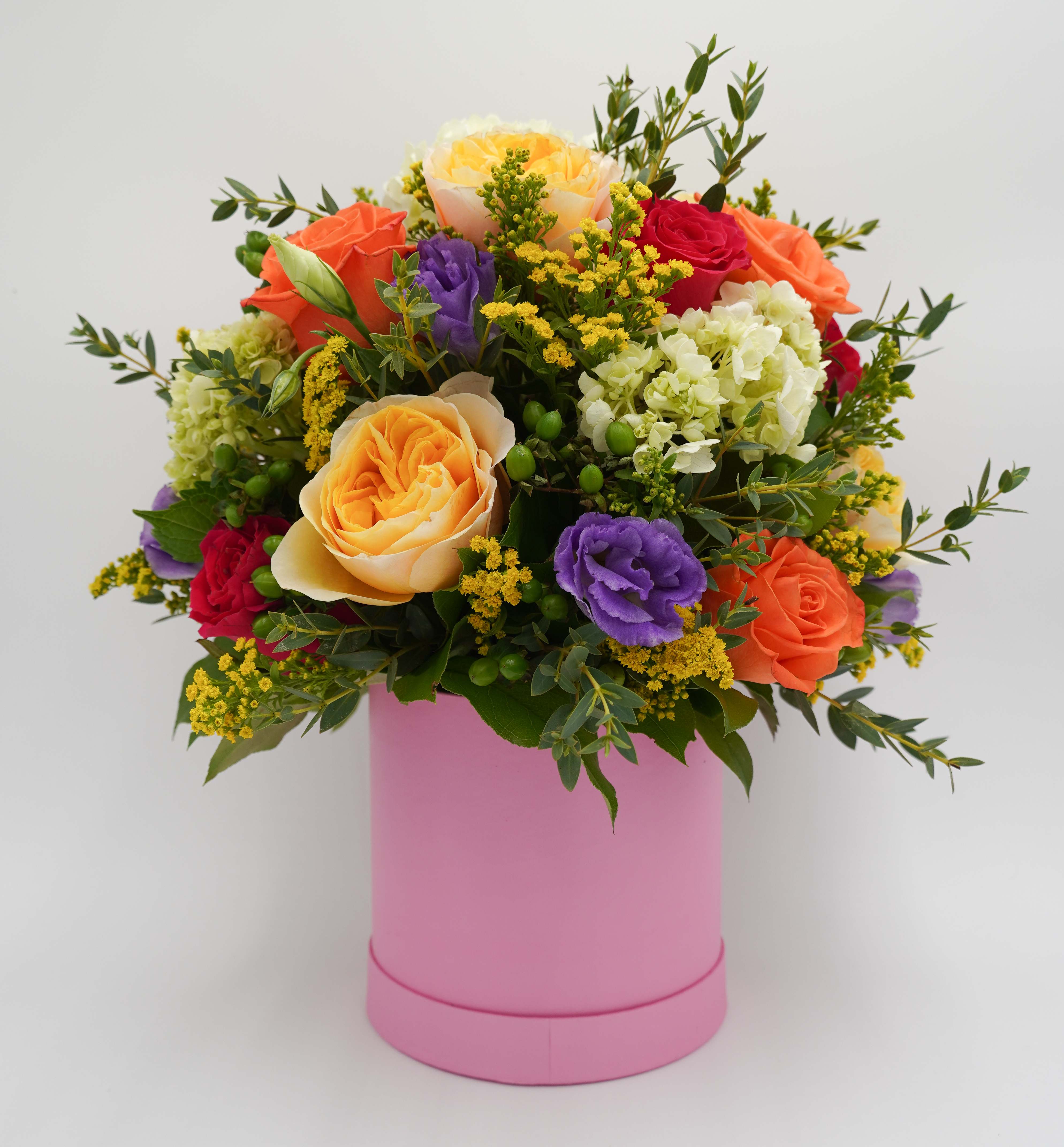 Wonderful Day by Atlanta's Finest Flowers - Orange Roses, Hot Pink Roses, Yellow Garden Roses, Hydrangea, Hypericum, Lisianthus, Yellow Aster, and Mix Geenery *Pink Box Material: Cardboard 7 x 7*