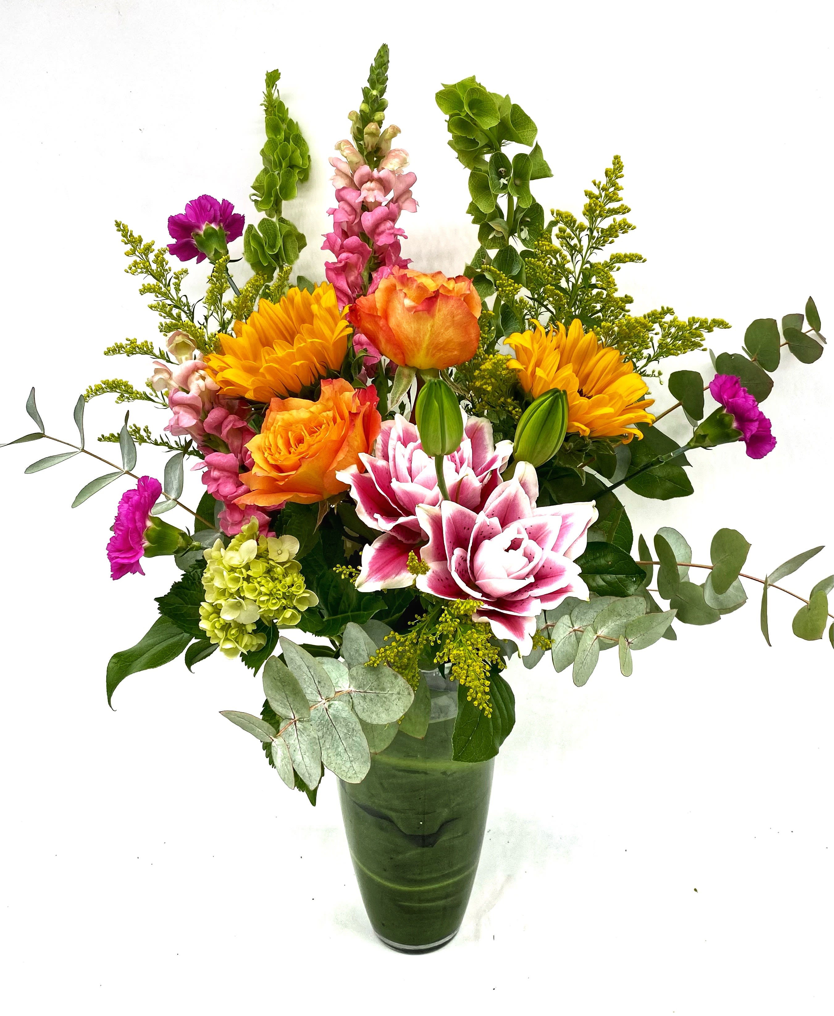 Bright Bounty  - This tall and upright vase of summer blooms is sure to impress. Featuring Oriental Lilies, Roses, Snap Dragons, Bells of Ireland and Solidago blooms makes for a bright array 