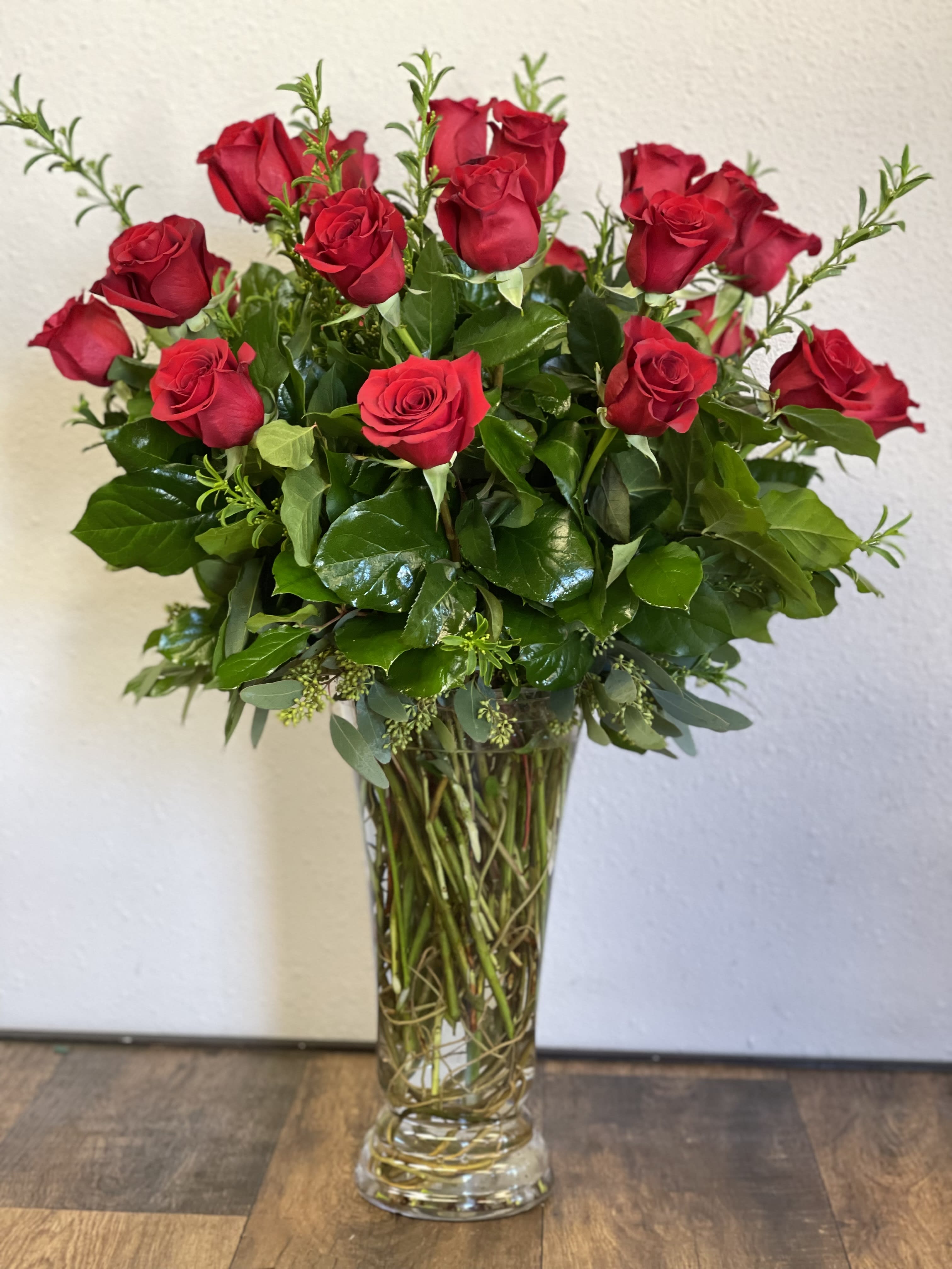 Classic Tall Rose Arrangement - Premium tall Ecuadorian Roses in elegant tall glass vase with greens and fillers 1 dozen Rose arrangement is standard **Photo shown is a 2 dozen Red Roses** ** Deluxe is 2 dozen Red Roses** ** Premium is 3 Dozen Red Roses**  If you prefer a different color please specify in the Comment section.   