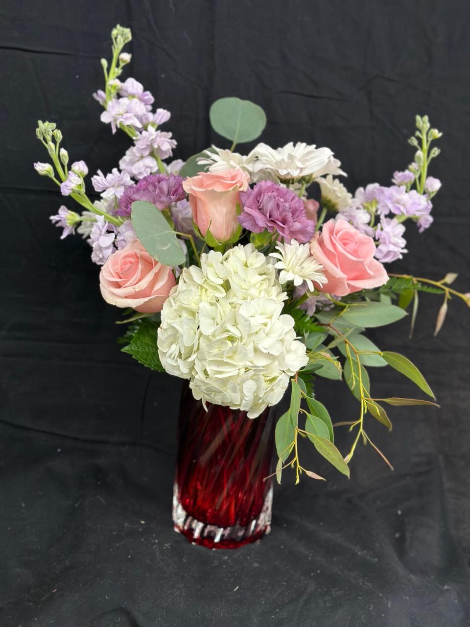 Mother's Day Special (limited quantities) - A beautiful soft pallet of colors stand out in this bold red keepsake vase. 