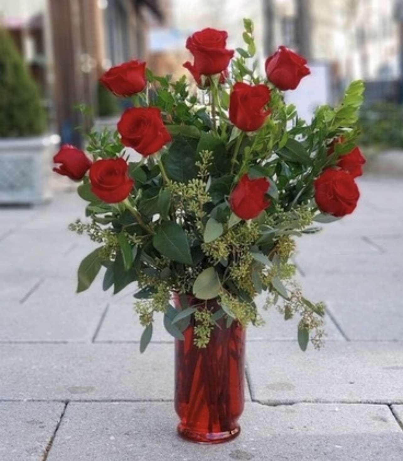 One Dozen Long Stem Red Rose Vase  - One dozen long stem red roses in a red vase