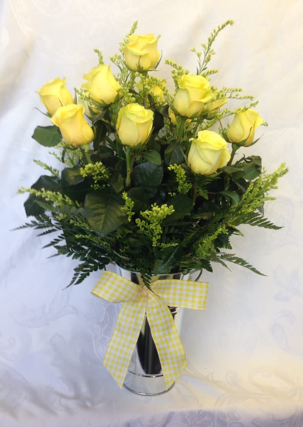 Dozen Yellow Roses Arranged - Beautiful long lasting premium yellow roses arranged in a clear vase with fillers. 12 for $95.00 18 for $135.00 24 for $165.00