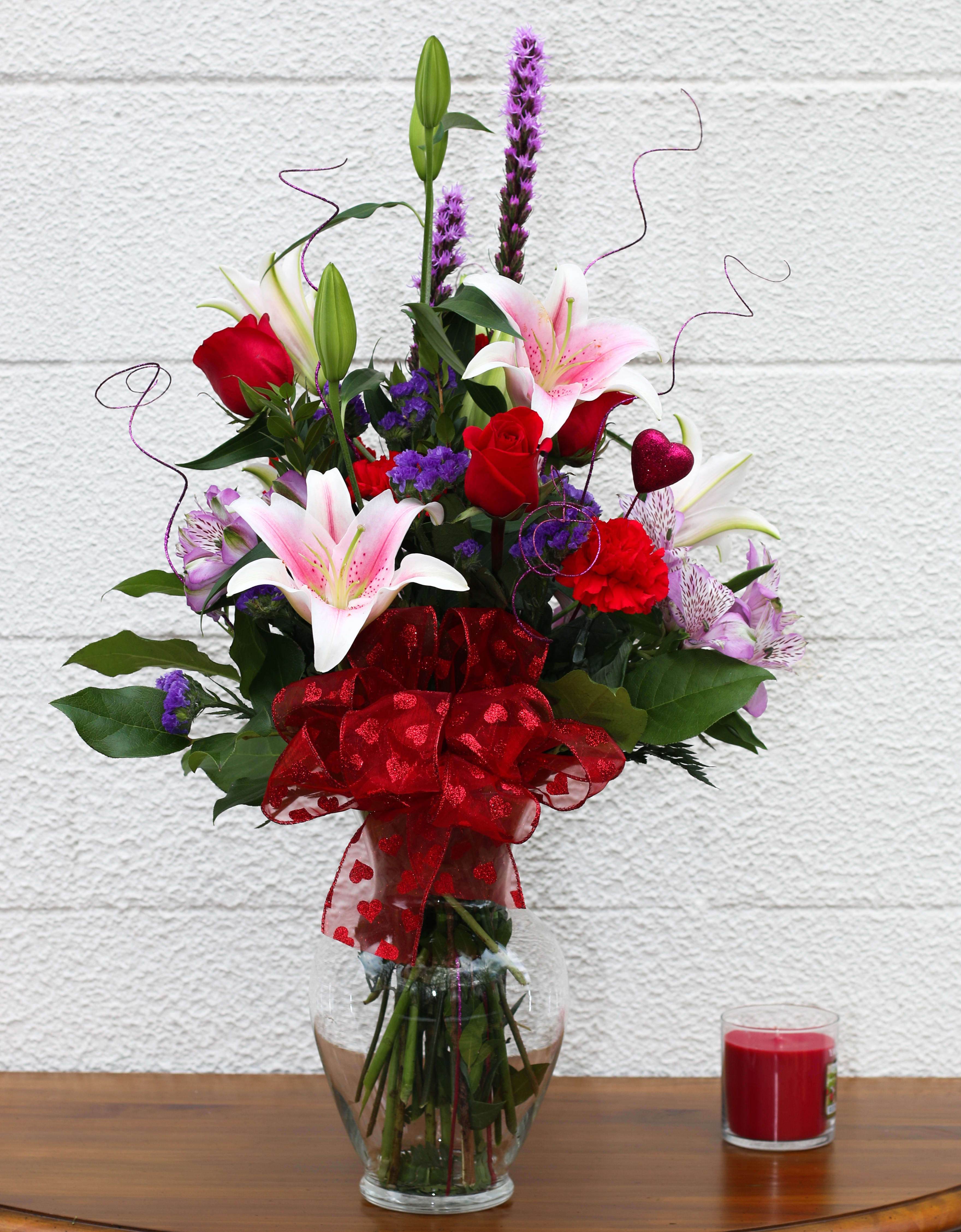 Simply Stunning FG203 Simply Stunning FG203 - Beautiful tall arrangement of red and purple flowers with lovely lilies. Approximately 28 1/2" H and 20 1/2" W.