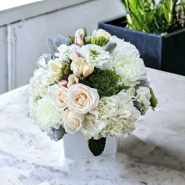 Pearl by Parisian Florist - Pearls are a beautful little gem that are so special and are created with special intent.  Well, this lovely arrangment is created with special intentions also.  To shine so bright and bring great joy!