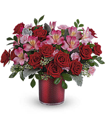 Scarlet Diamond Bouquet - Embossed with an elegant diamond pattern and shimmering with a pearlescent finish, this glam glass vase makes extra special moment  when filled with a beautiful red and pink bouquet. This arrangement includes red spray roses, pink alstroemeria, miniature light pink carnations, dusty miller, seeded eucalyptus and huckleberry. This red and pink bouquet is delivered in Teleflora's Scarlet Diamond Cylinder.