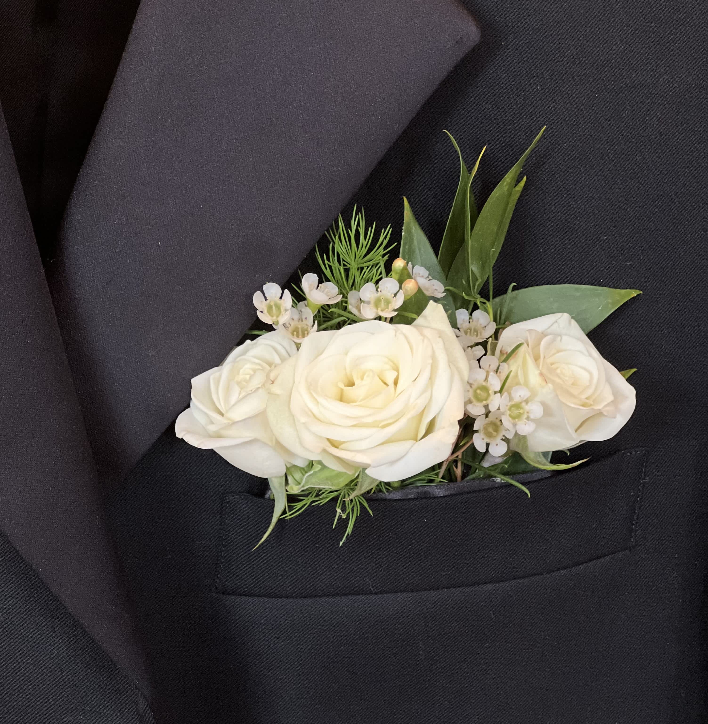 White Pocket Square - This elegant pocket square is a cool alternative to the traditional boutonniere.