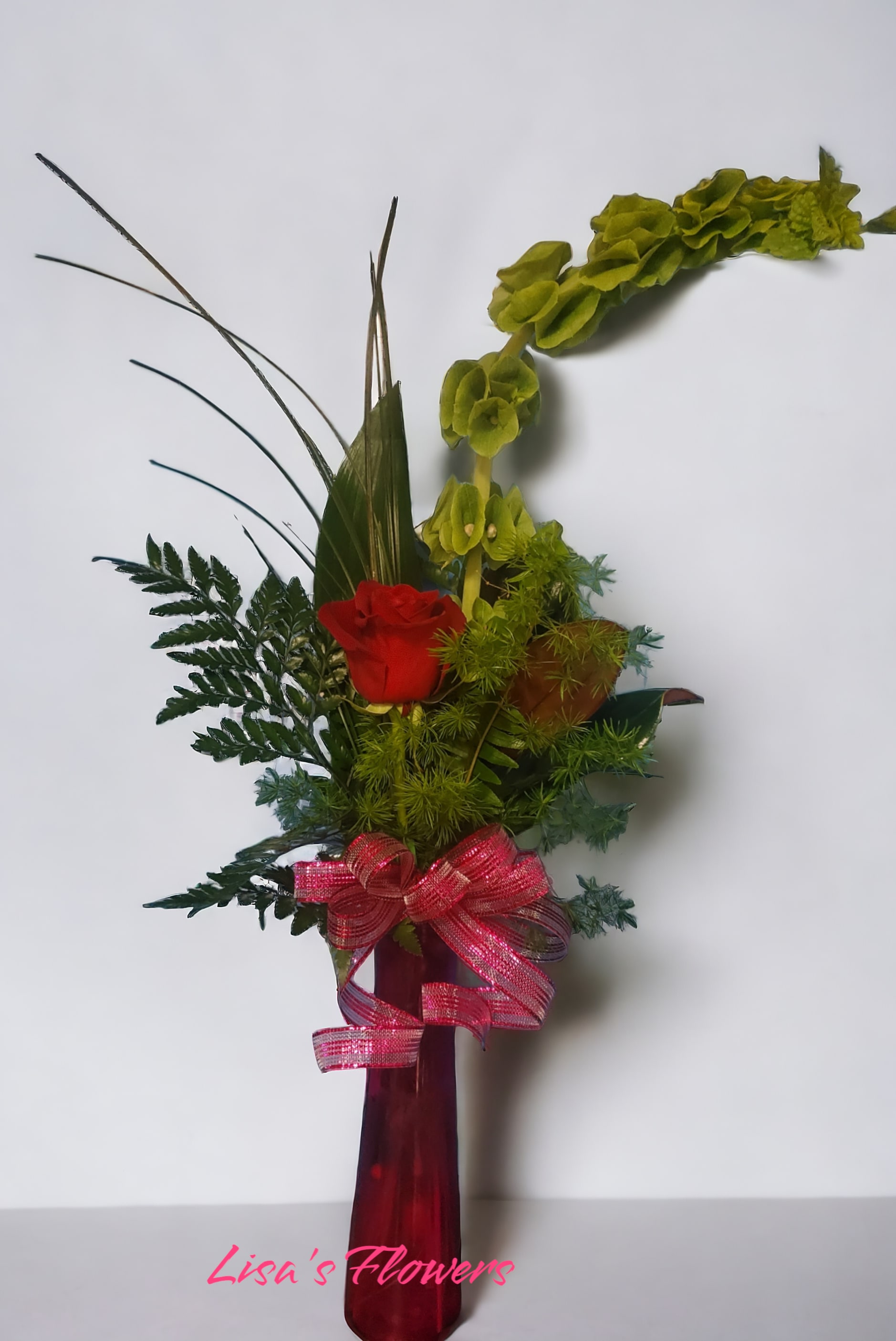 Remember Me Bud Vase - Roses and mixed foliage in a modern bud vase. 