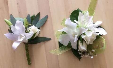 PROM: CORSAGE WITH SPECIAL BRACELET PROM: CORSAGE WITH SPECIAL BRACELET - We make custom corsages and boutonniers for Prom. Just give us a call and we will discuss all the details together, so you can have the design you desire. (305) 640 8657 These products are not available for delivery unless you need a few units. Price shown is for the corsage only. The price for the boutonniere is $19.95.