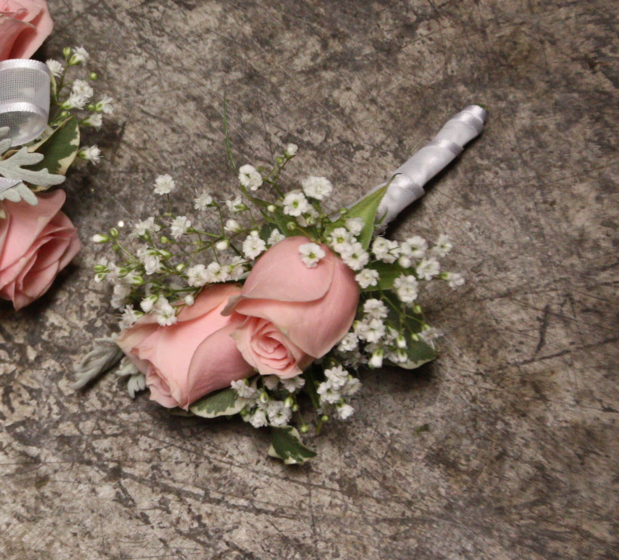 Cotton Candy Boutonniere Cotton Candy Boutonniere - Select this boutonniere of pink spray roses, babies breat and a white stem wrap. ALL PROM FLOWERS ARE AVAILABLE IN COLORS PICTURED OR A CUSTOM SELECTION. CHOOSE YOUR FLOWER COLORS, RIBBON COLOR AND ANY ADD ONS. FOR QUESTIONS CALL A FRIENDLY SALES REPRESENTATIVE AT STRELITZIA FLOWER CO.
