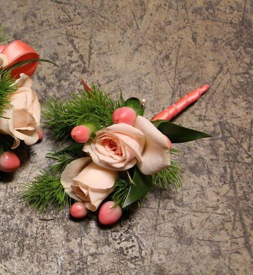 Desert Sun Boutonniere Desert Sun Boutonniere - Select this boutonniere of beautiful spray roses accented with hypericum berries and ribbon. All Prom Flowers are available in colors pictured or a custom selection. Choose your flower colors, ribbon color and any add ons. For questions call a friendly sales representative at STRELITZIA FLOWER CO.