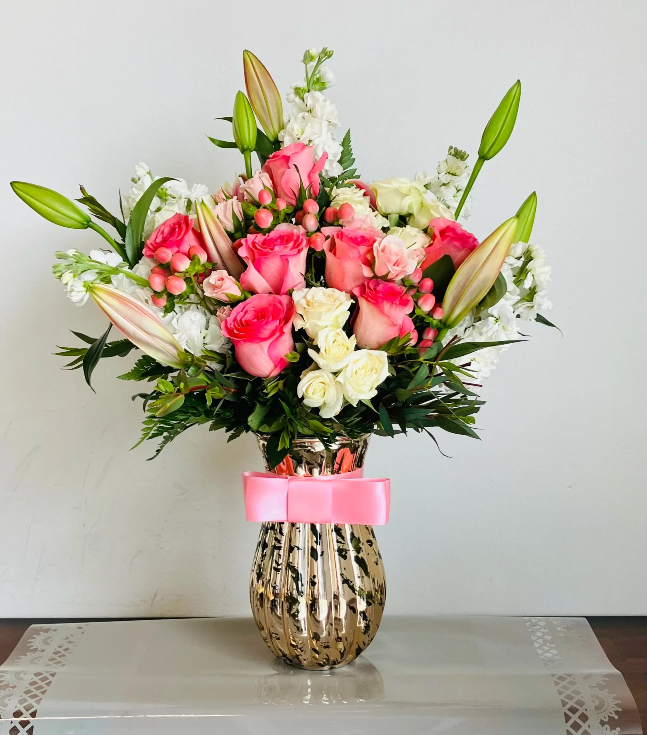 Blush Beauty - Send your Mother this elegant design this Mother's Day. Arranged in a Unique Iridescent Gold Vase, Hydrangeas, Roses, Lisianthus, Spray Roses and Eucalyptus burst out with love. This arrangement is truly one of a kind! 