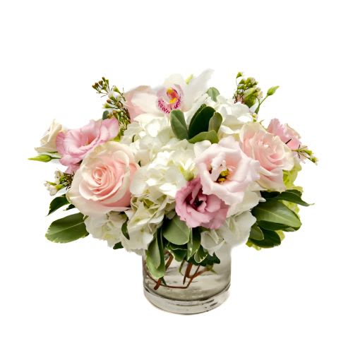 SFD20211 - Blushing Bunch  - This arrangement is a best seller of hydrangea, lisianthus, roses, cymbidium orchids and wax flower in beautiful pastel shades of pink and greens and will definitely send a smile 