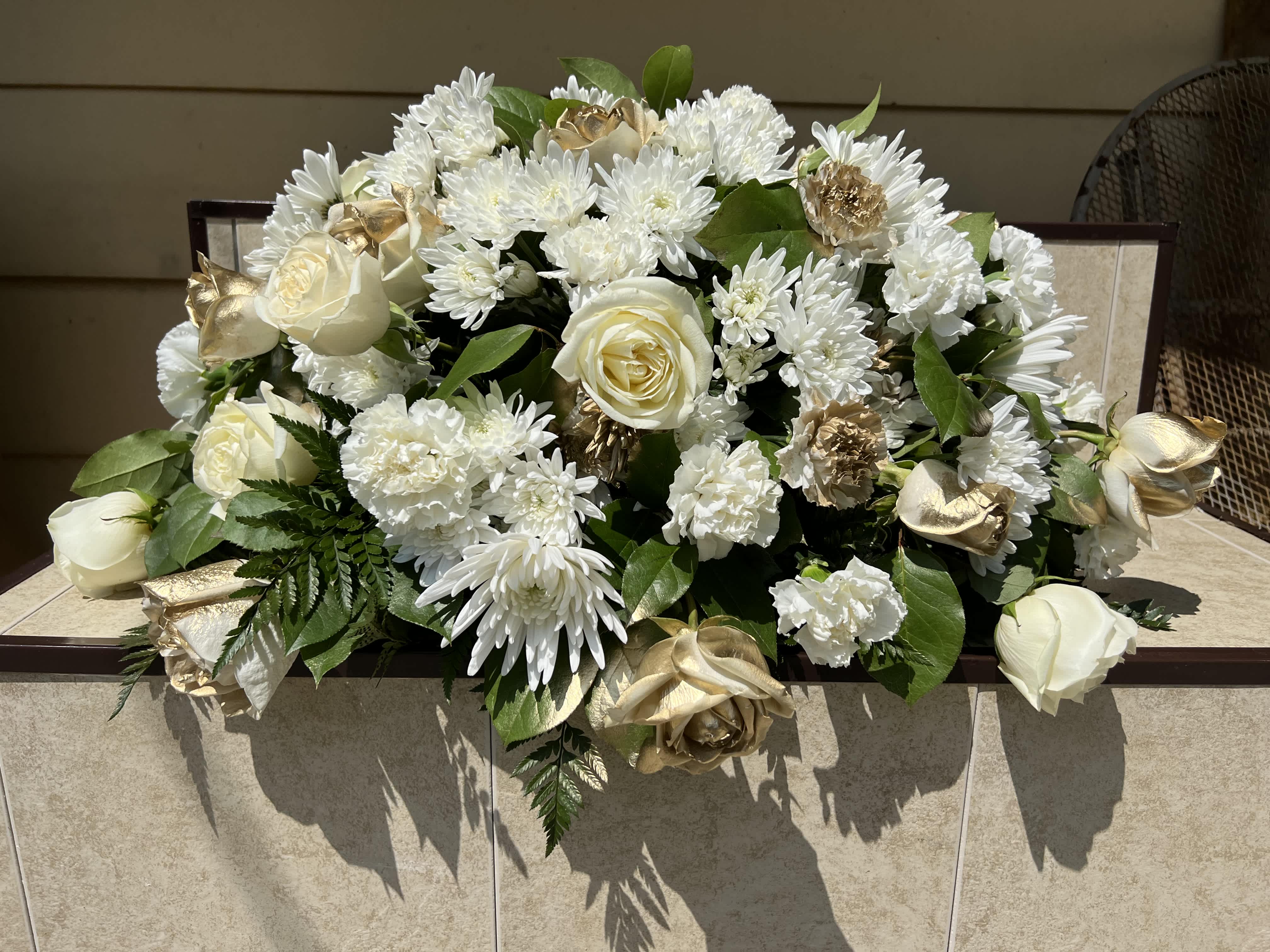 Gold and White casket spray  - Gold and white casket spray with roses and mixed flowers.  (All arrangements can be custom to colors of choice)