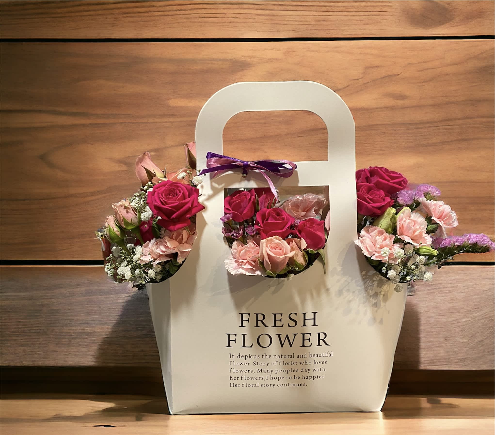 Roots of Love - An abundance of pretty pink hues, this gorgeous bouquet features spray roses and carnations with complementary seasonal blooms exquisitely arranged.