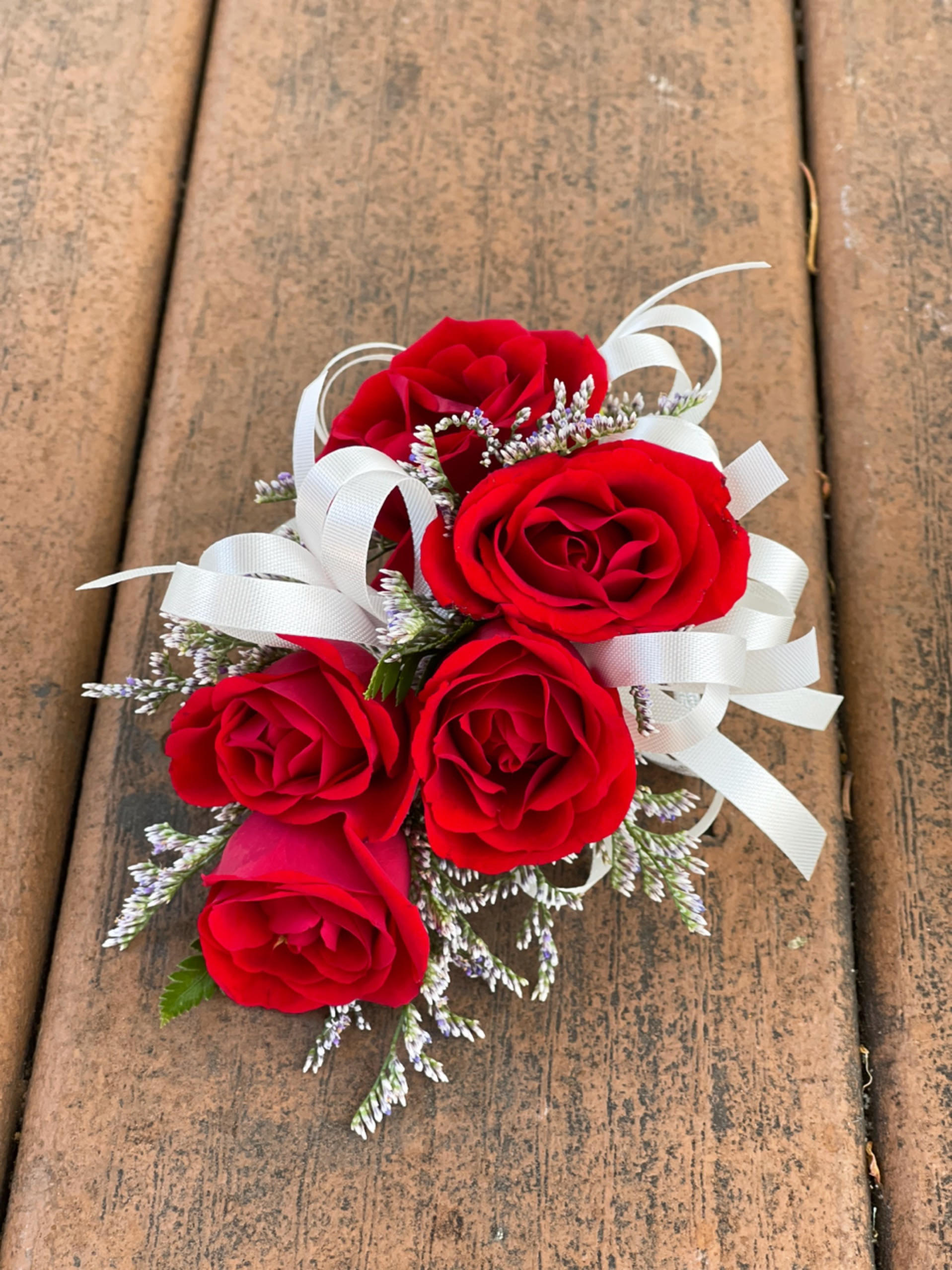 Wrist Corsage (Red Flowers &amp; White Ribbon) - (IN STORE PICKUP ONLY!) -Color change can be requested in &quot;Special Instruction&quot; at check out. Spray Rose with Ribbon Measurement: Length 5 inch                         Width   3 inch  ===Copy and Paste below with input into Special Instruction to customize colors===                           &quot; Color Change                              Ribbon Color: &quot;
