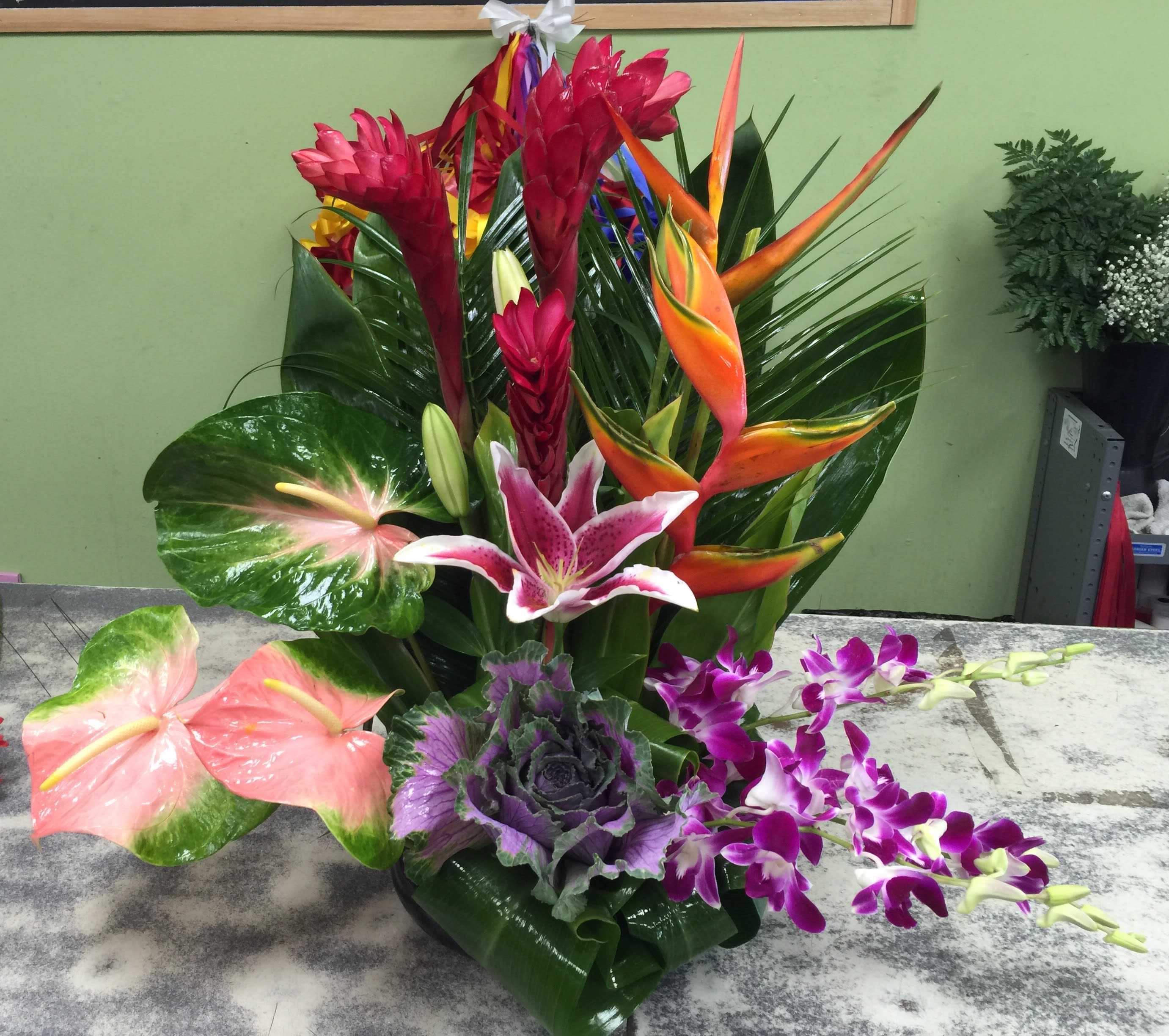 Casa De Flores Tropical Arrangement - Mixture of tropical flowers combined to make an exotic design! Perfect for any occasion!