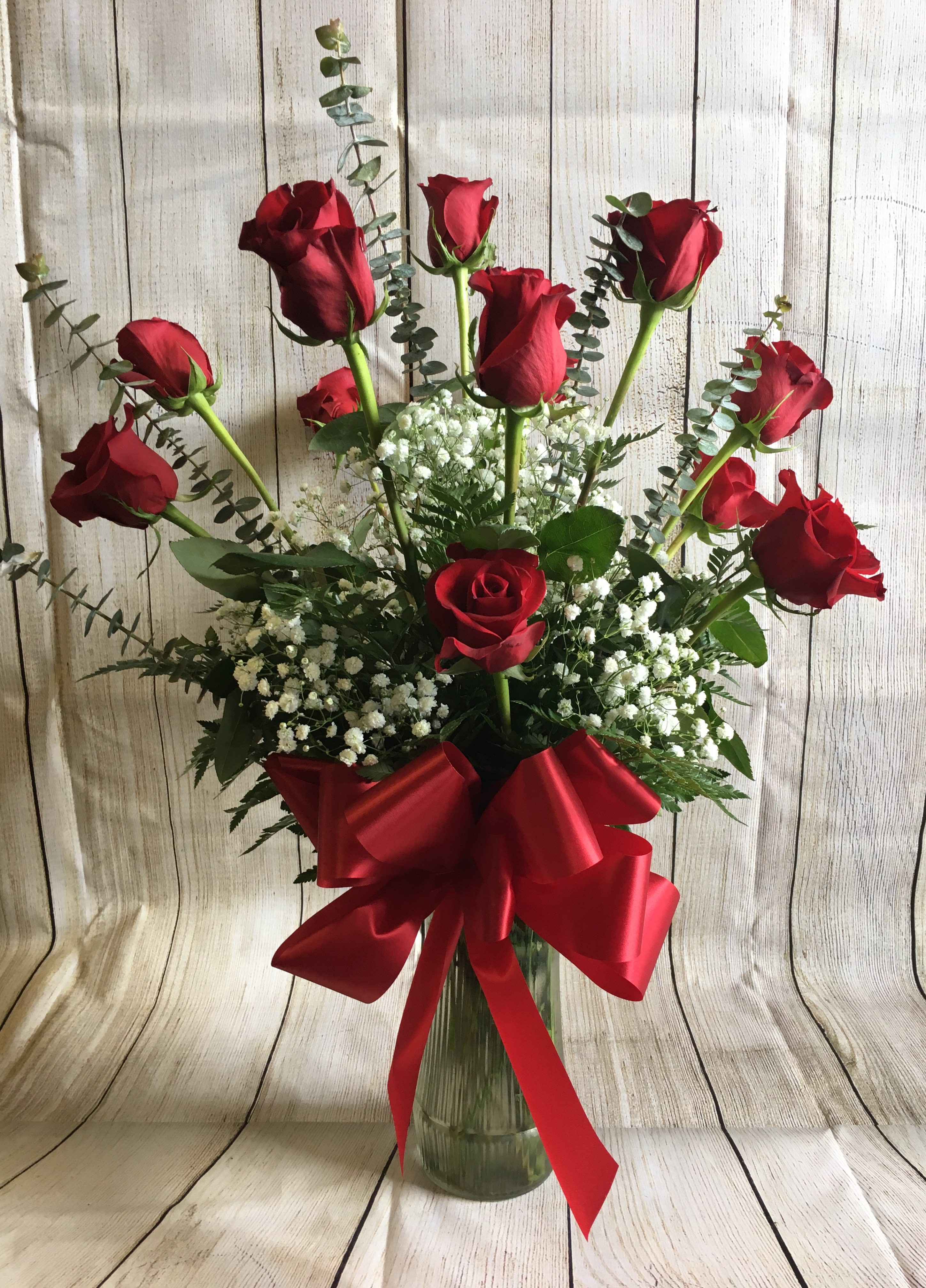 Dozen Roses (Specify color in special instructions) - A dozen red roses are always perfect, always savored. A traditional, beautiful way to express your love. Color of bow and filler will vary. Available in red, pink, white, yellow, lavender, orange and mixed with special request. Most colors available within a 24 hour notice.