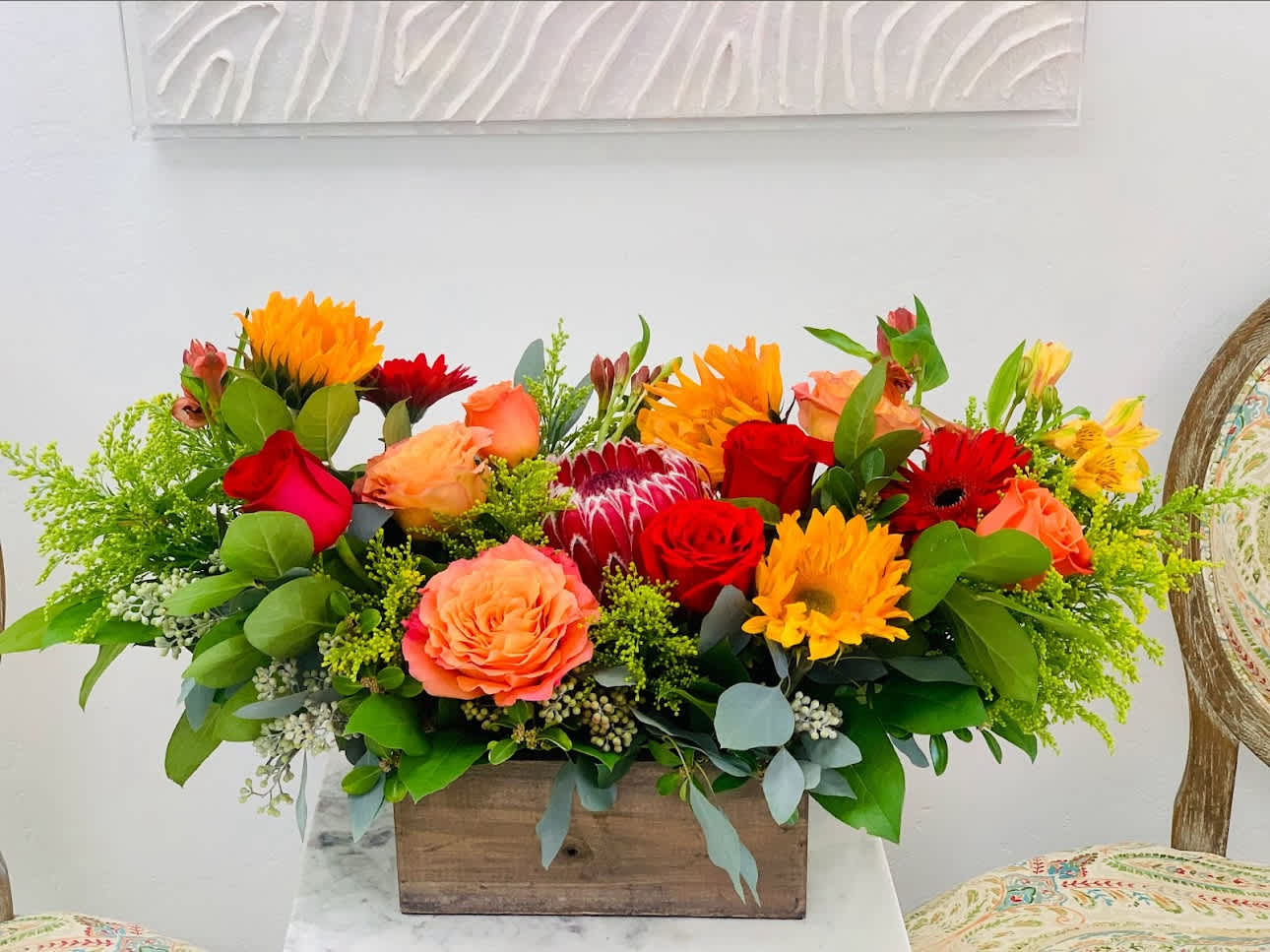 Mother’s Smile  - This happy arrangement will bring a smile to your mom’s face! Freshest blooms arranged in a wooden box. 