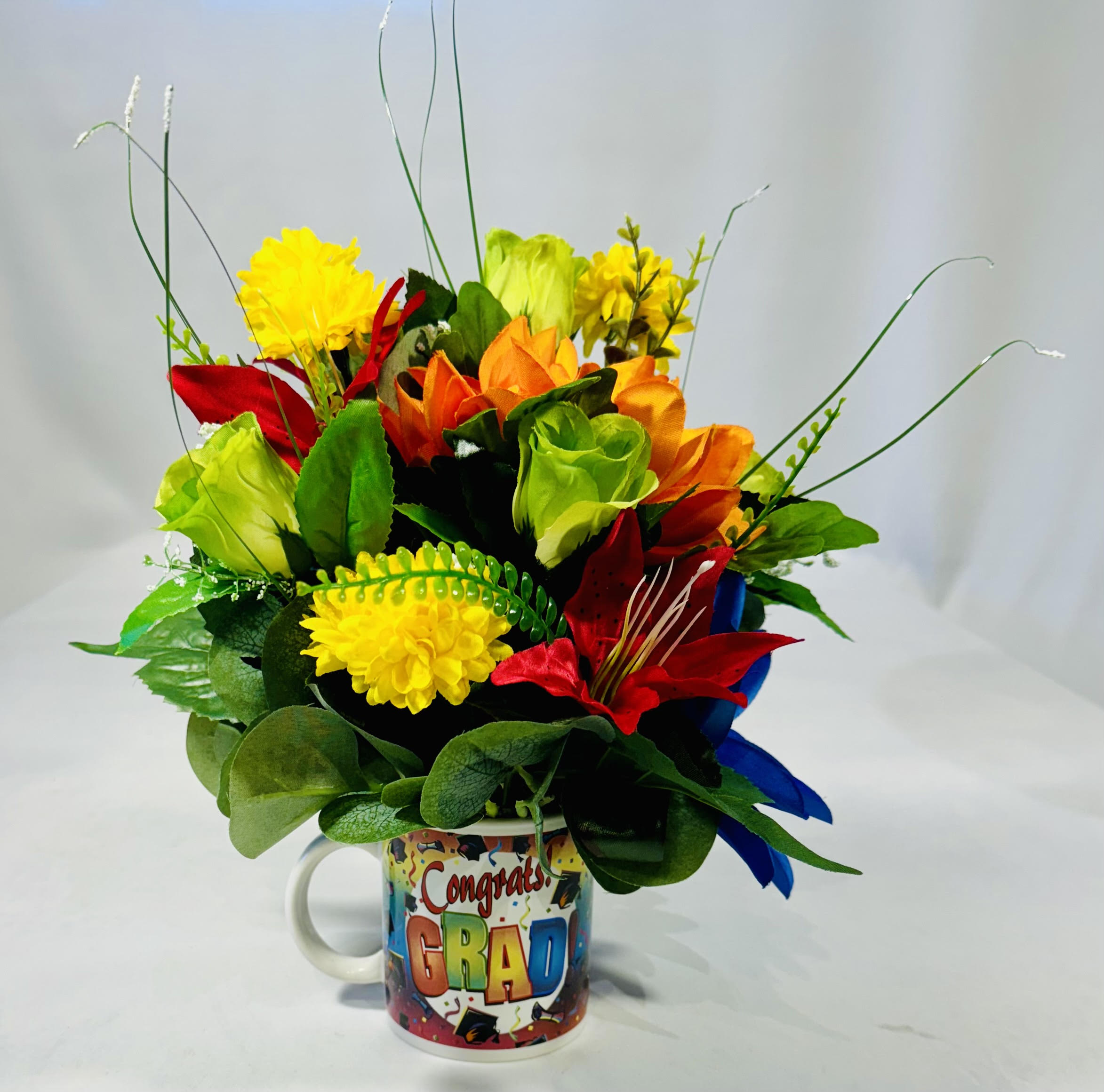 Congrats Grad Silk Floral Coffee Mug Congrats Grad Silk Floral Coffee Mug - Congrats Grad Silk Floral Coffee Mug is full of color. And a excellent gift to send to a new Graduate to have for a forever keepsake. 12" T 9" W