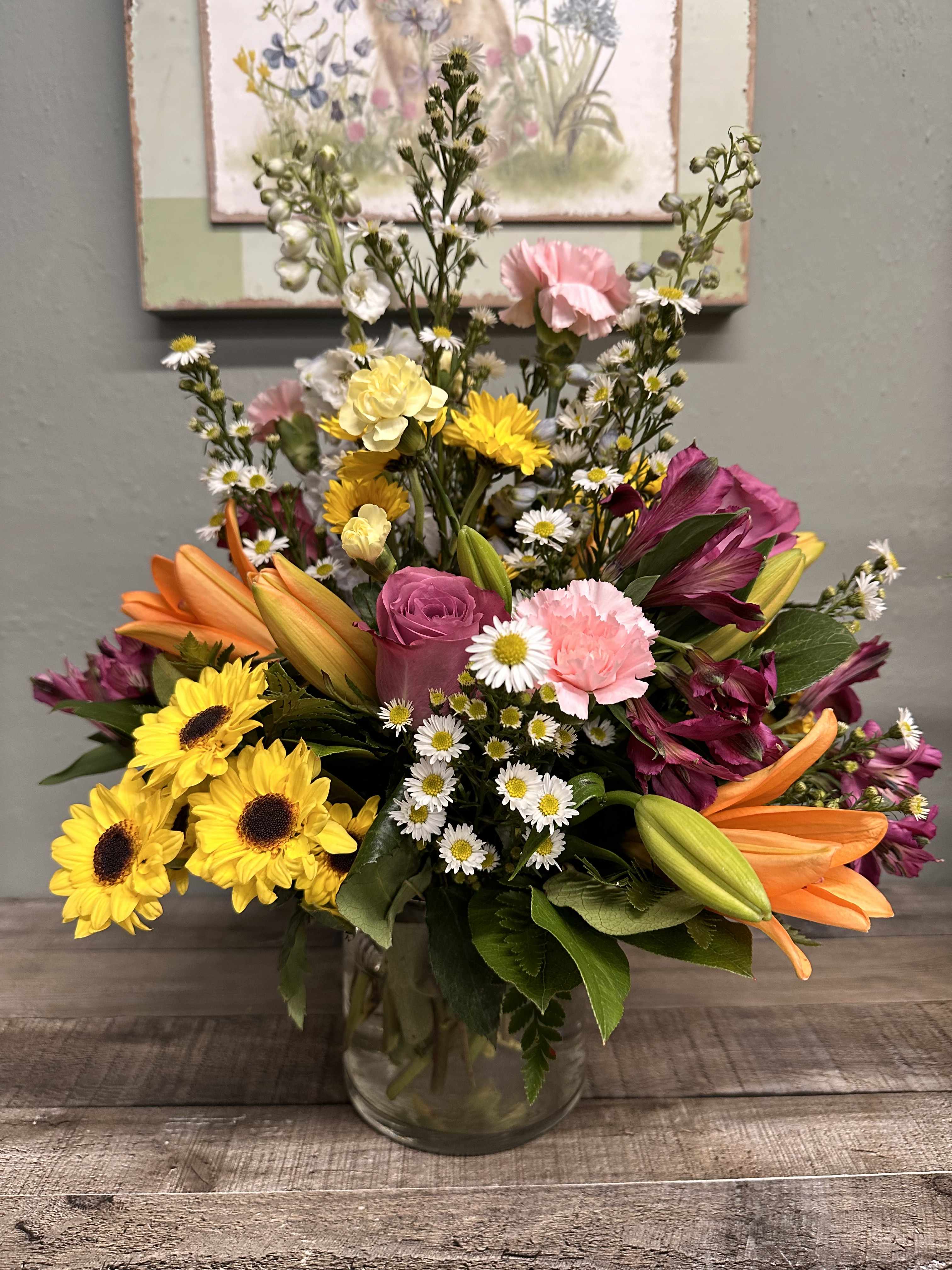 Kaleidoscope by BloomNation™ Kaleidoscope by BloomNation™ - A full-color explosion, Kaleidoscope by BloomNation™ is a beautiful gift for any occasion. Fresh and colorful blooms arranged in a low round vase vase, this arrangement is all about standing out from the crowd. In an all around style.