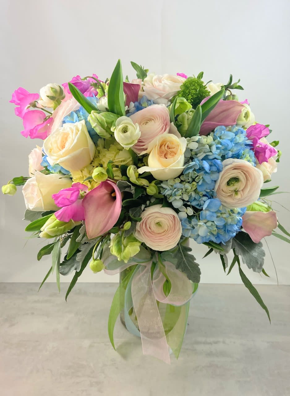Chelsea Garden Bouquet - Reminiscent of the lush gardens that adorn the English countryside, Chelsea Garden bouquet is a decidedly luxurious collection of flowers for someone very special!  Featuring blue hydrangea, helleborous &amp; sweet peas from Japan when available, blush hybrid ranunculus form italy, tulips, garden roses, mini callas, hypericum and eucalyptus, this bouquet is &quot;dressed to impress&quot;.