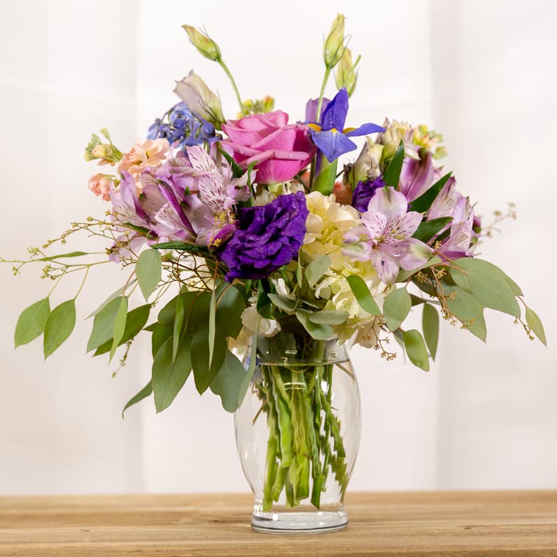 Lavender Lovely - A beautiful assortment of lavender, purple, and cream colored  flowers.