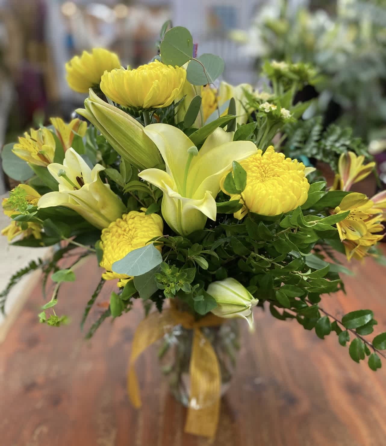 Mellow Yellow - A variety of mixed yellow flowers will make anyone smile. Flowers may be subsituted.