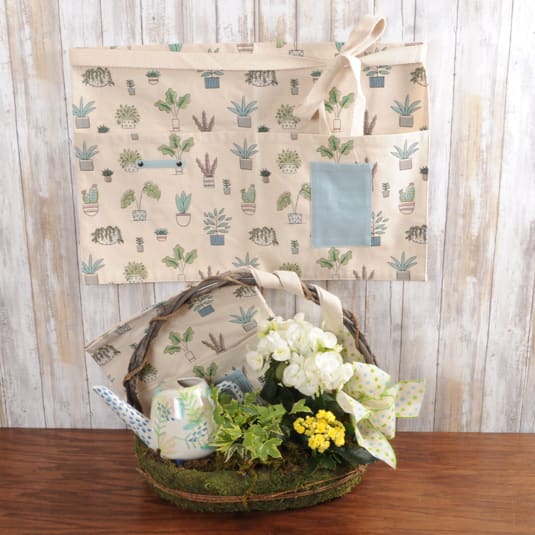 Moms Garden - Perfect Gift for a PLANT LOVING MOM! Comes with an assortment of live plants, a keepsake ceramic watering can, a waist tie gardening apron with pocket in a moss handles re-useable basket- great gift for Mothers Day!  