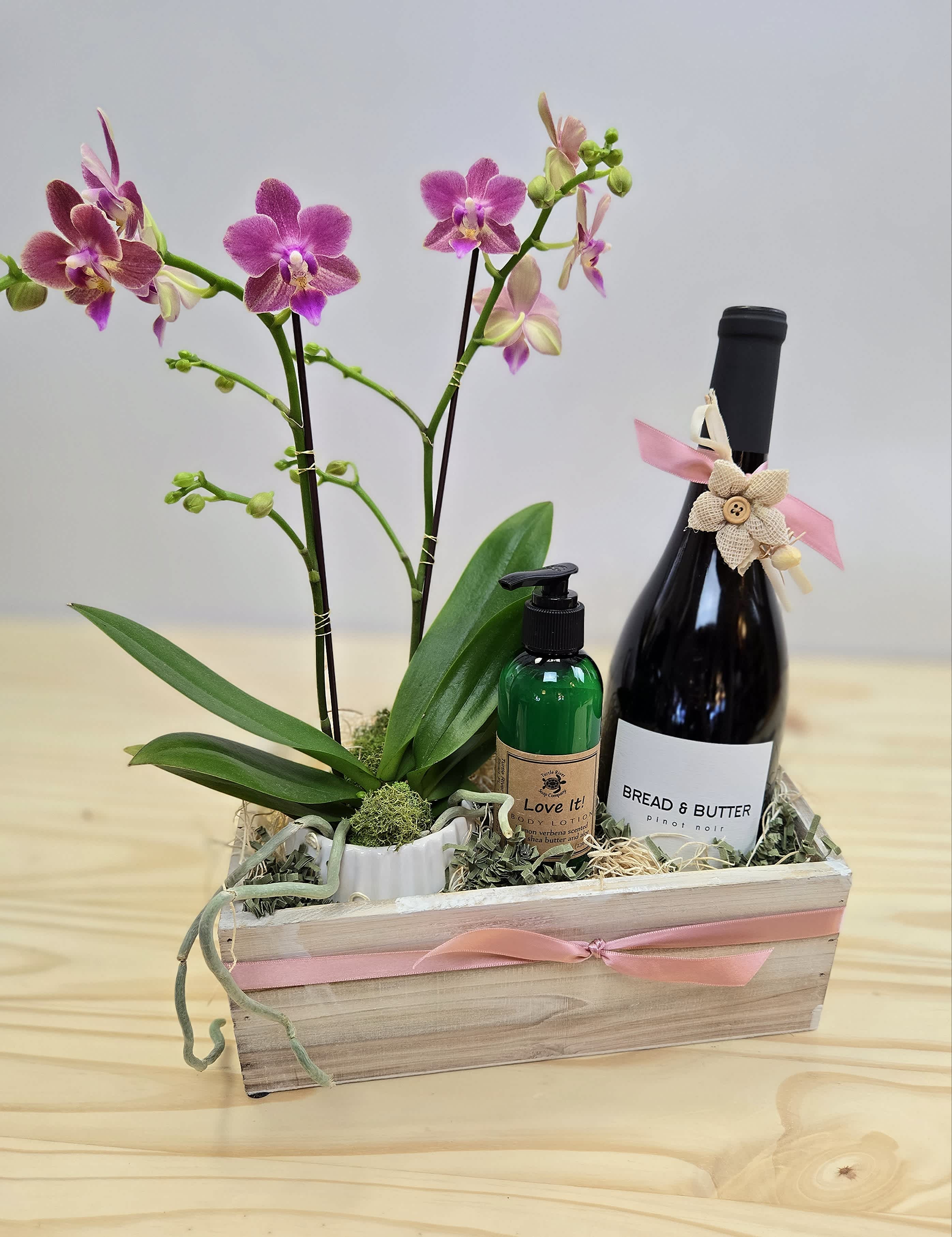 Mom's Happy Orchid Pinot Noir Box - **TOP SELLER, WHEN AVAILABLE!! Wood box complete with live orchid plant (color/variety may vary) in a ceramic container, Bread and Butter Pinot Noir and Turtle River Soap Co. locally handmade all natural lotion. The perfect gift for Mothers' day or any occasion!