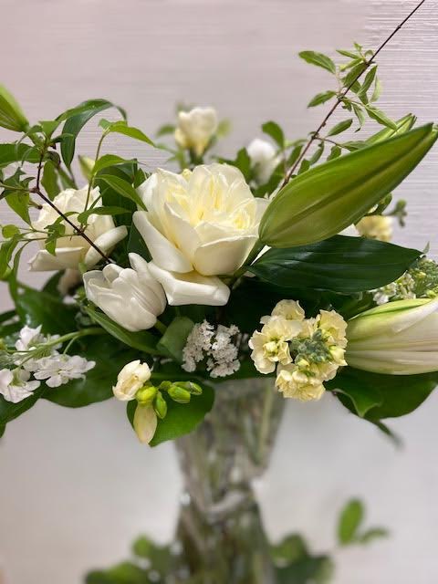Sympathy Arrangement Sympathy Arrangement - A classic arrangement of white and green fresh seasonal blooms.