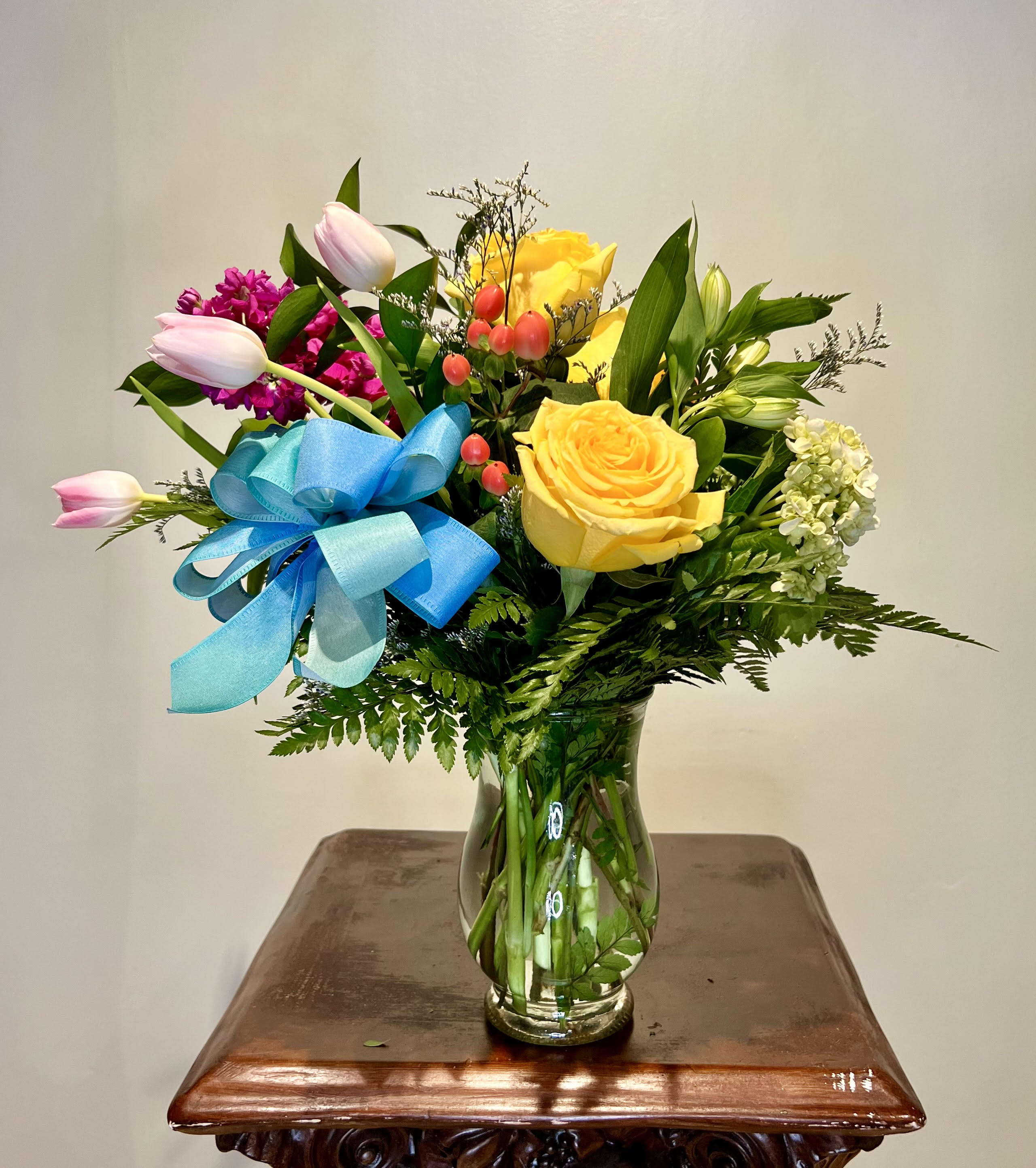 Mother Knows Best  - This beautiful bouquet with a twist of modern style is wonderful way of showing you mother how much you care. Shorter in stature but not small in color, these bright blooms will be sure to put a smile on her face this mothers day.