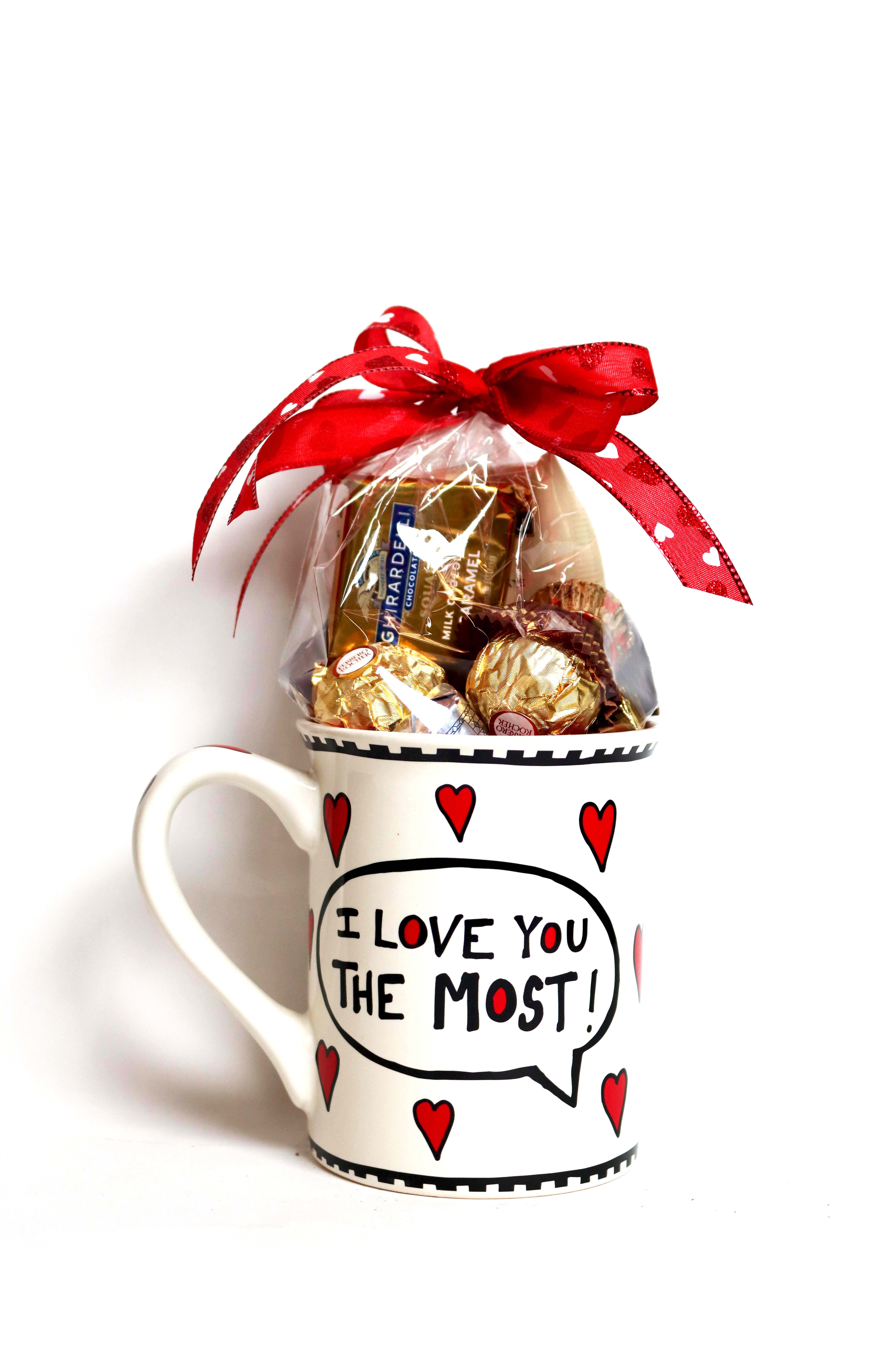 I Love You The Most - The assorted chocolate selection inside a trendy mug with text bubbles and a heart design makes this the perfect gift for Valentine’s Day or an anniversary. This 16 oz., high-quality stoneware mug is dishwasher and microwave-safe. 