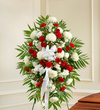 Deepest Sympathies Red &amp; White Standing Spray - With red flowers that symbolize love and white flowers that symbolize reverence, this beautifully crafted standing spray conveys all the love and sympathy you feel deep in your heart. Our expert florists use only the freshest blooms for an arrangement that reflects your compassion and support. Standing spray arrangement of fresh red and white flowers such as roses, hybrid lilies, carnations and more Appropriate for family, friends and business associates to send directly to the funeral home Our florists use only the freshest flowers available, so colors and varieties may vary Large measures approximately 54&quot;H x 36&quot;L without easel Medium measures approximately 48&quot;H x 36&quot;L without easel Small measures approximately 42&quot;H x 36&quot;L without easel
