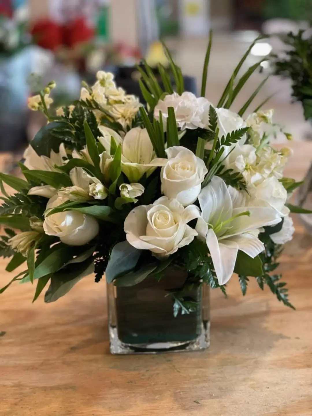 Cloud Nine  - New beginnings deserve flowers! This all white arrangement includes roses, lilies and/or other seasonal blooms and greenery. Cloud Nine is the perfect gift for celebrating a new year, a new baby, or a newly married couple.   Vase and flowers may vary based on availability. APPROXIMATE DIMENSIONS 15&quot; W X 13&quot; H