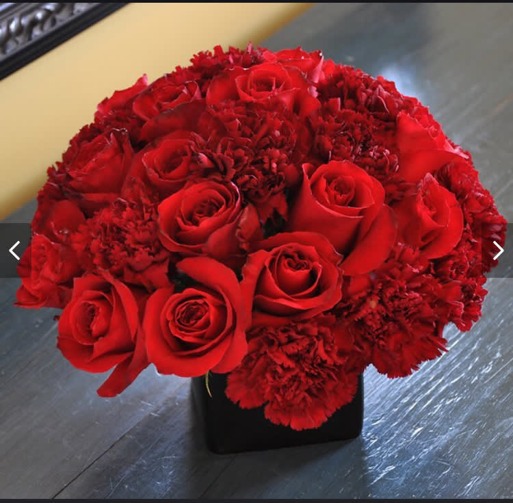 Passion - Pamper your loved one with a stunning combo of roses and carnations.   Delivery minimum is $50.00 Our DELIVERY SERVICE IS TILL 3 PM We cannot guarantee requests for a specific time of delivery. There might be flower substitutions, due to low supply of certain flowers. However, we do our best to provide you with the same look and feel of the arrangement. Our main goal is to always give our customers quality flowers and service. To make sure that you get the exact same flowers, ordering a few days ahead of desired delivery date is key.