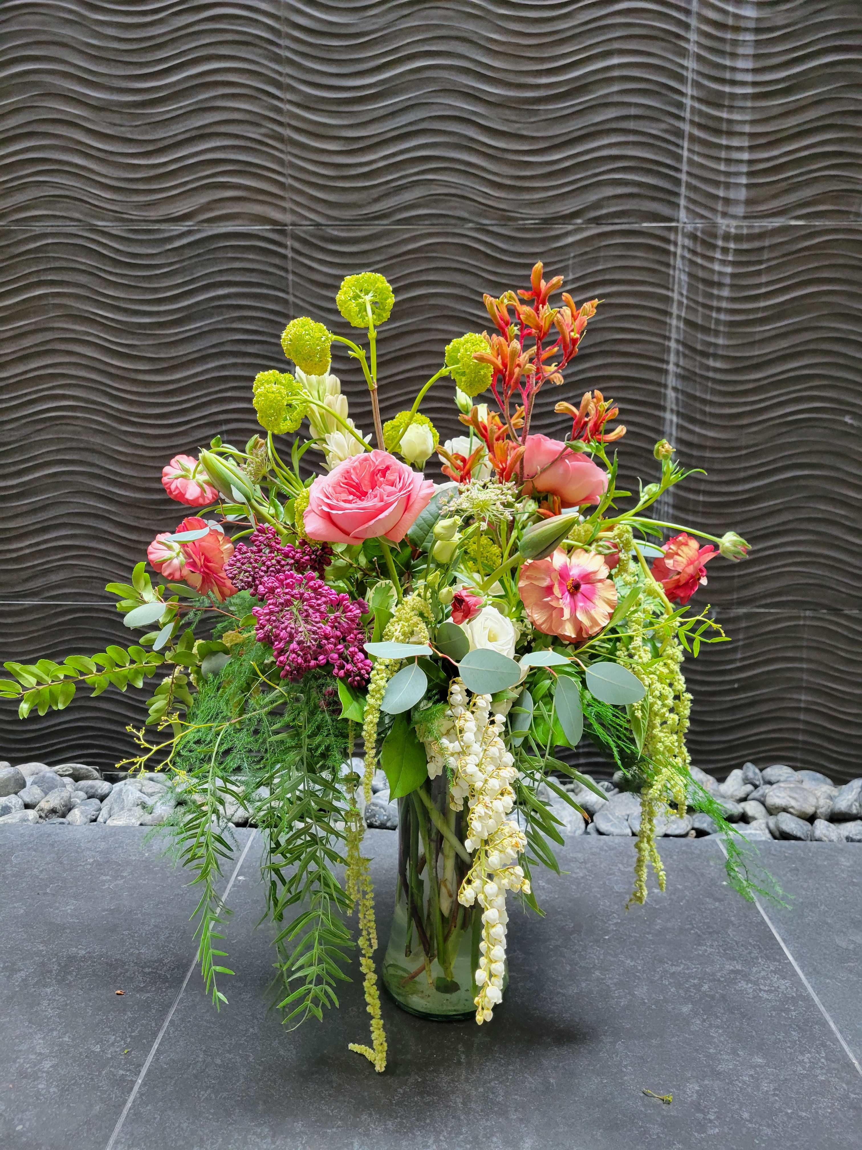 Funky Cold Medina   - this arrangement is full of beautiful spring and summer flowers from permium roses, hydrangeas, aluminum, tulips butterfly rununculus, and so much more! 