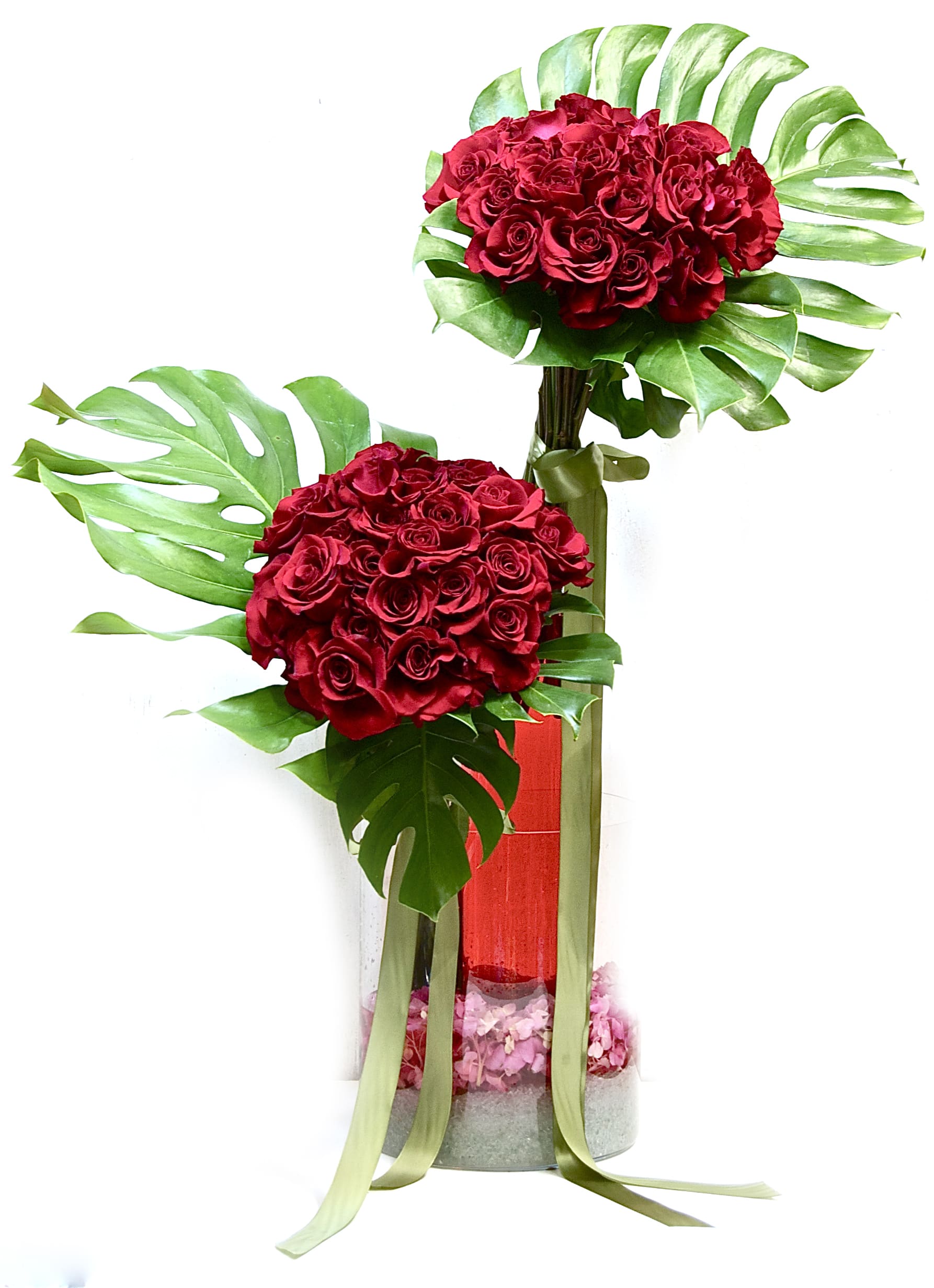 Red Roses Standing Tall Red Roses Standing Tall - 2 clusters of 2 dozen red roses in each, styled modern with beautiful greenery