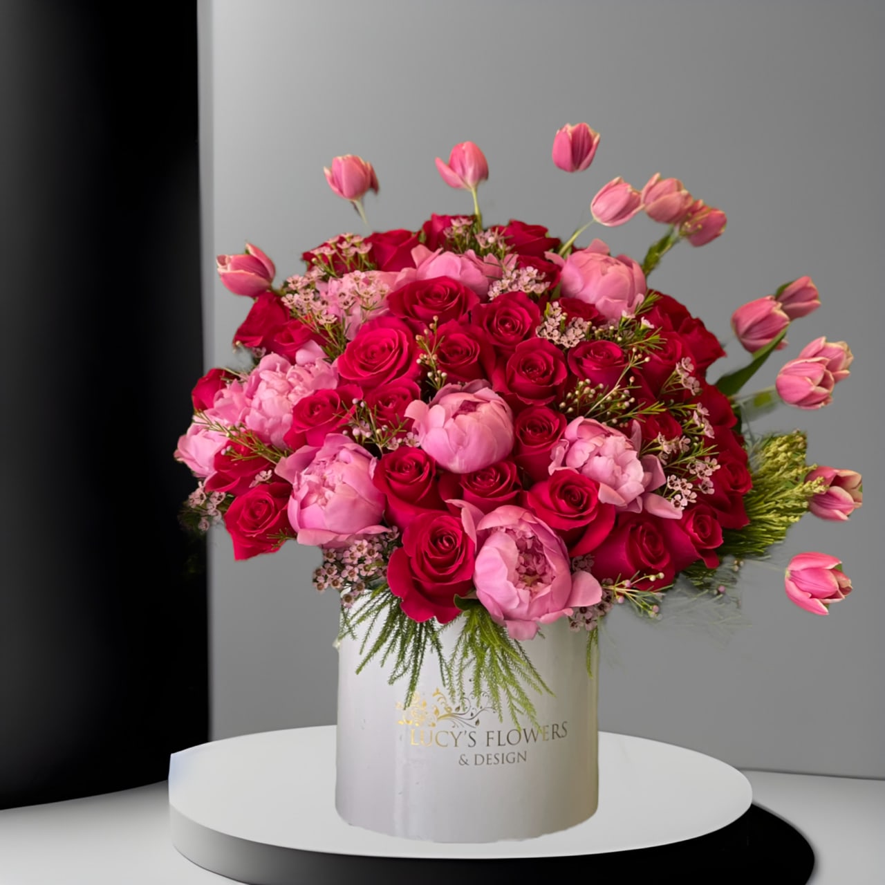 "Pink & Pearly" "Pink & Pearly" - Oh-so pink,oh-so pretty,oh-so pleasing! Fragrant peonies, roses and tulips are the perfect combination of blooms designed in our signature box. Show your appreciation with a heartfelt arrangement to brighten their day. Disclaimer: Photo shown on this arrangement is a Deluxe or Premium version of the arrangement.