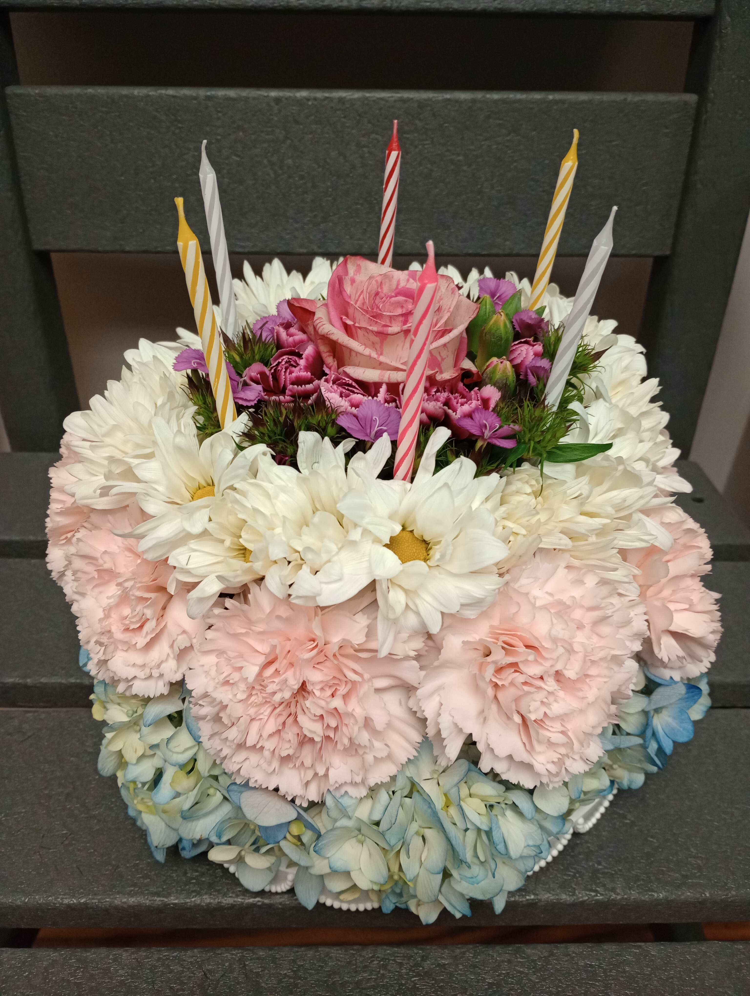 Bloom Me A Piece Bloom Me A Piece - Yes! Finally, a cake that you can love and not have to worry about those pesky calories. We can design a custom floral cake for your special someone's birthday any day of the week. Let us know their favorite colors and we will make it up. Now they can have their cake and smell it too.