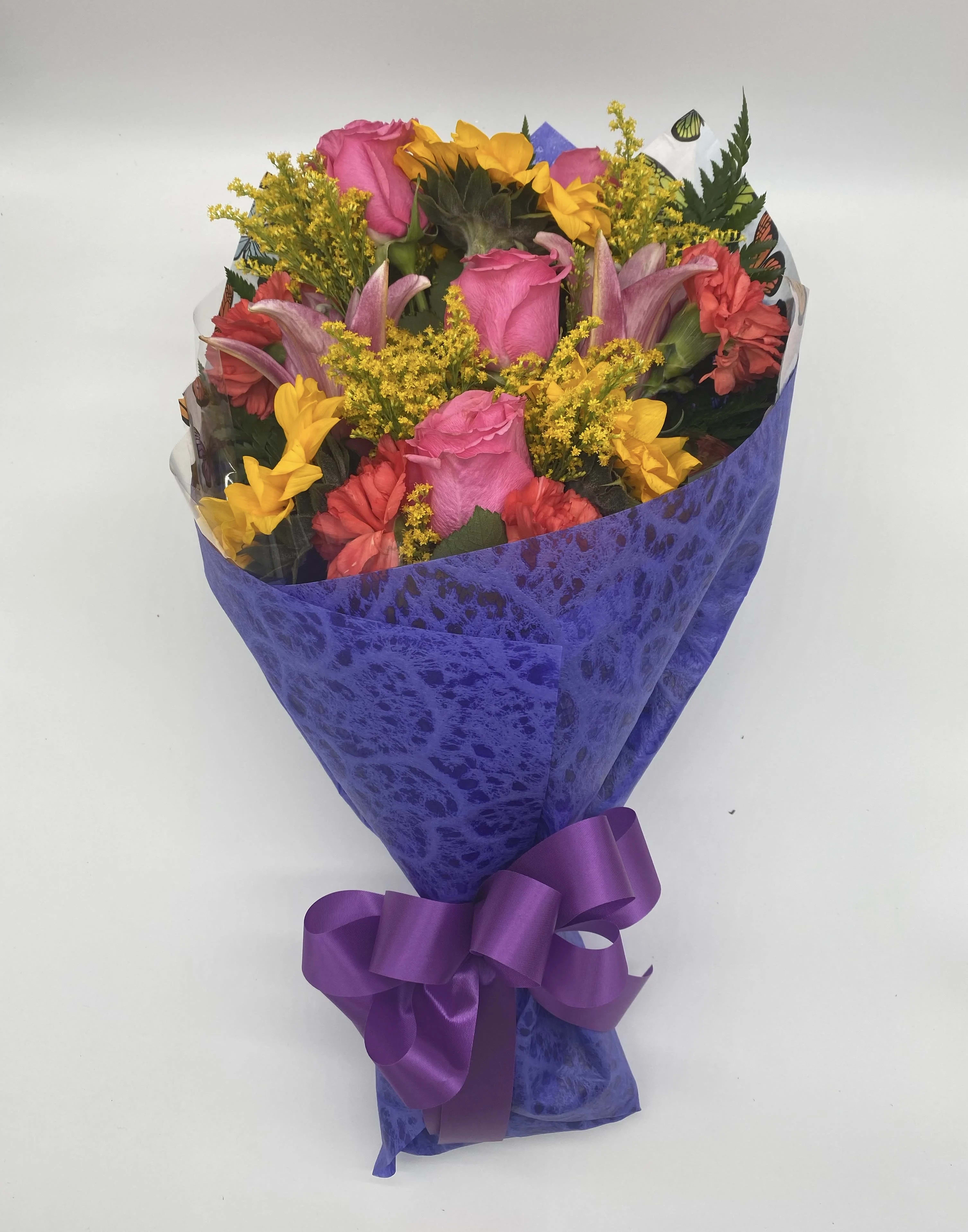 Dazzling Days Wrapped Bouquet - Dazzling Days  Wrapped Bouquet includes lilies, roses, sunflowers and other fresh bold flowers. Our loose bunches do NOT include vases. Paper and bow color will vary.