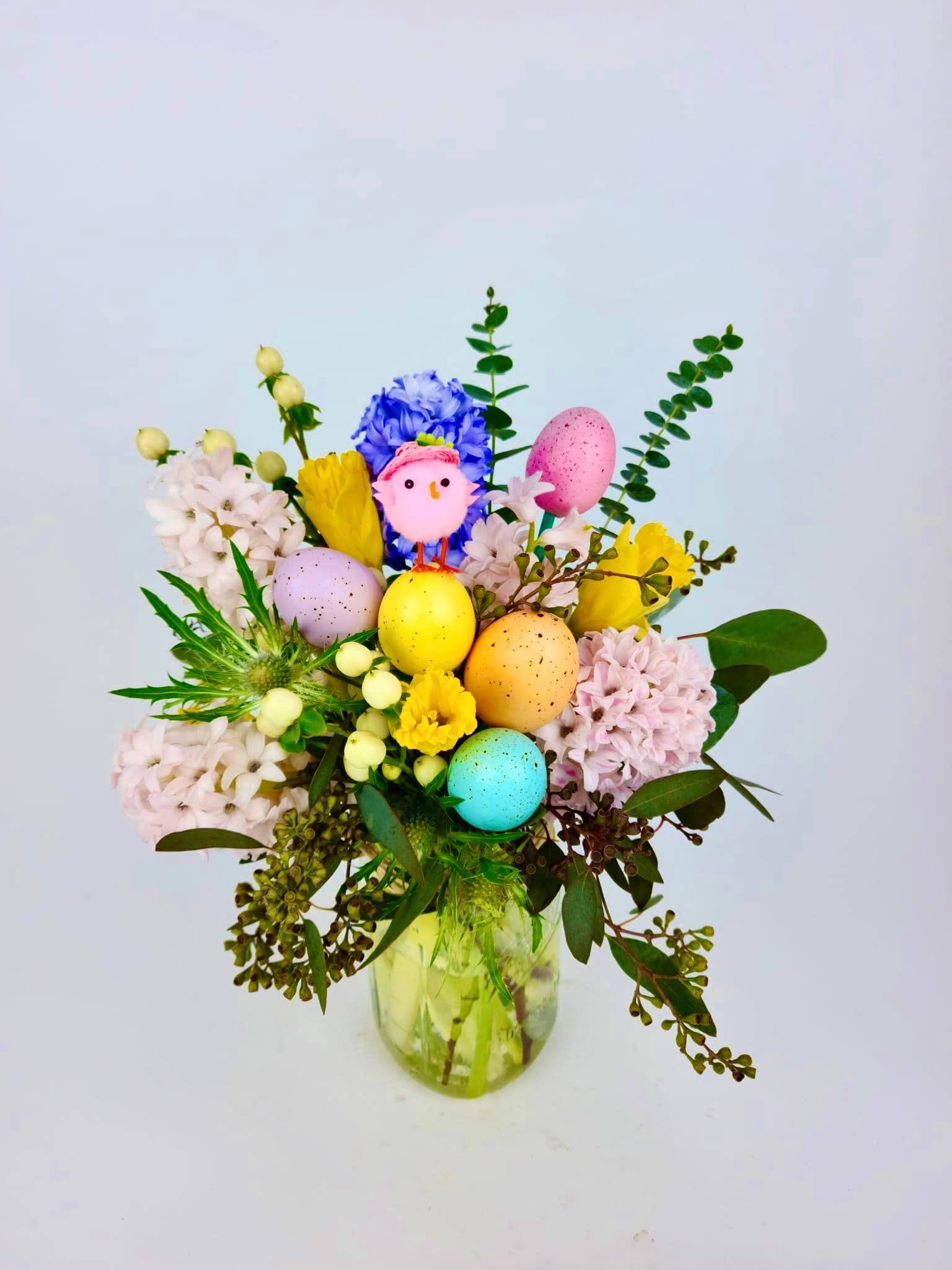 Colorful Spring  - Colorful arrangements of hyacinths, Daffodils, Hypericum, Seeded Eucalyptus, Thistle Flower, colorful eggs, and a mini chick with mix greens.   There is a window of 24 hours to fulfill these order. 
