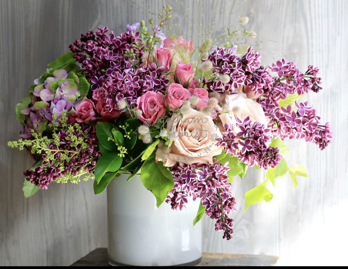 Sweet Lilac - (LILACS HAVE A SHORT VASE) Seasonal lilacs with roses. A sweet spring arrangement. Send the prettiest flowers from the best florist in new york and west chester. #lilacs #mothersday