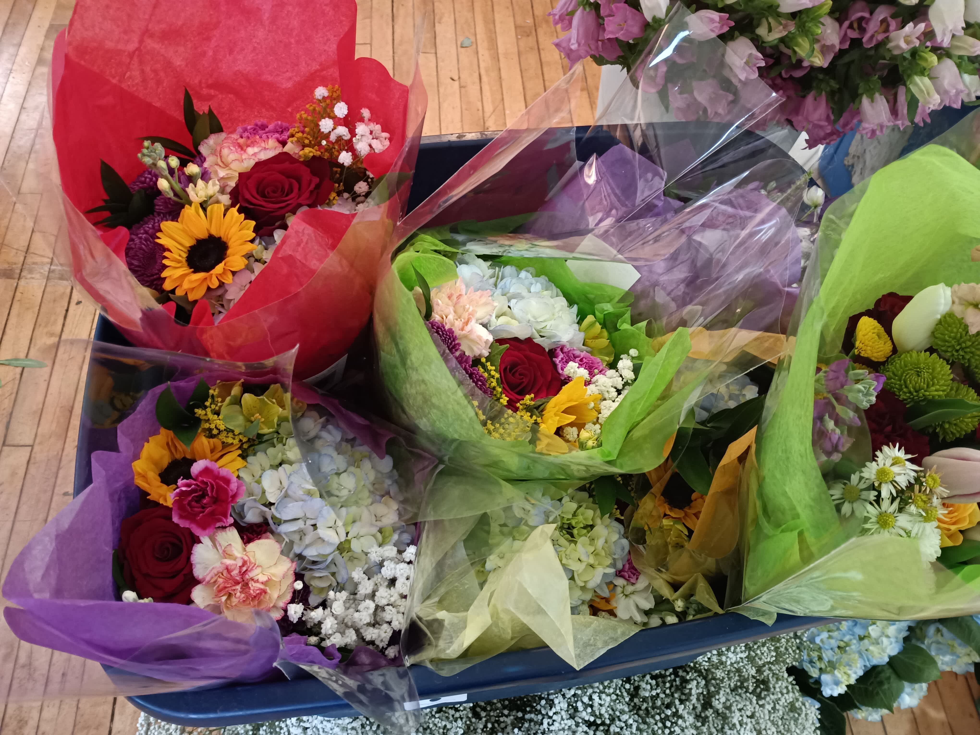 'Ready to go&quot; assorted wrap - Mix of assorted fresh flowers including hydrangea, rose, alstroemeria, stuck, daisies, baby's breath and g5reens in a tissue paper and cellophane sleave 
