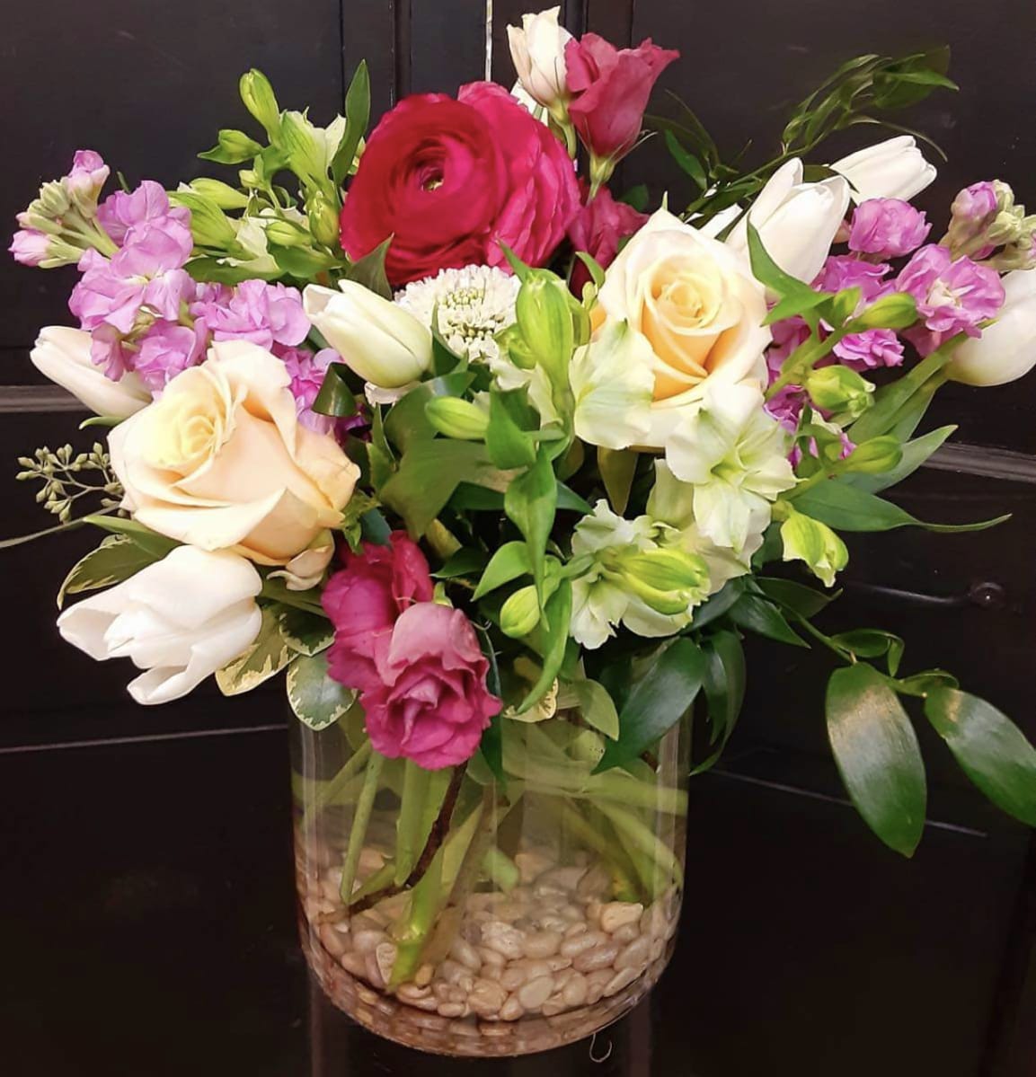 Rose Garden - Medium sized vase arrangement with roses, stock, tulips, and ranunculus. 