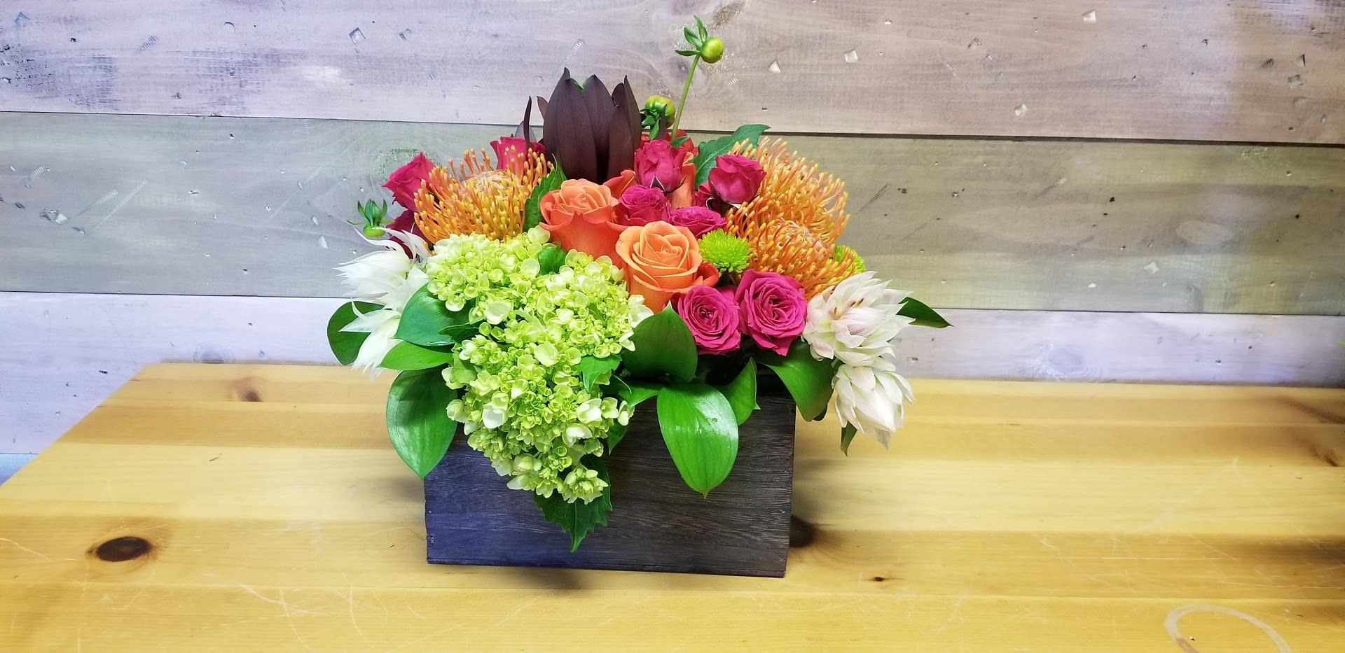 Color box Color box - A bright colorful box of flowers to make anyone's day a brighter day. This box can change with the season and availability, it will always have a bright colorful look.****Flowers and color may vary on season and availability.**** As always the flowers will be the freshest available.