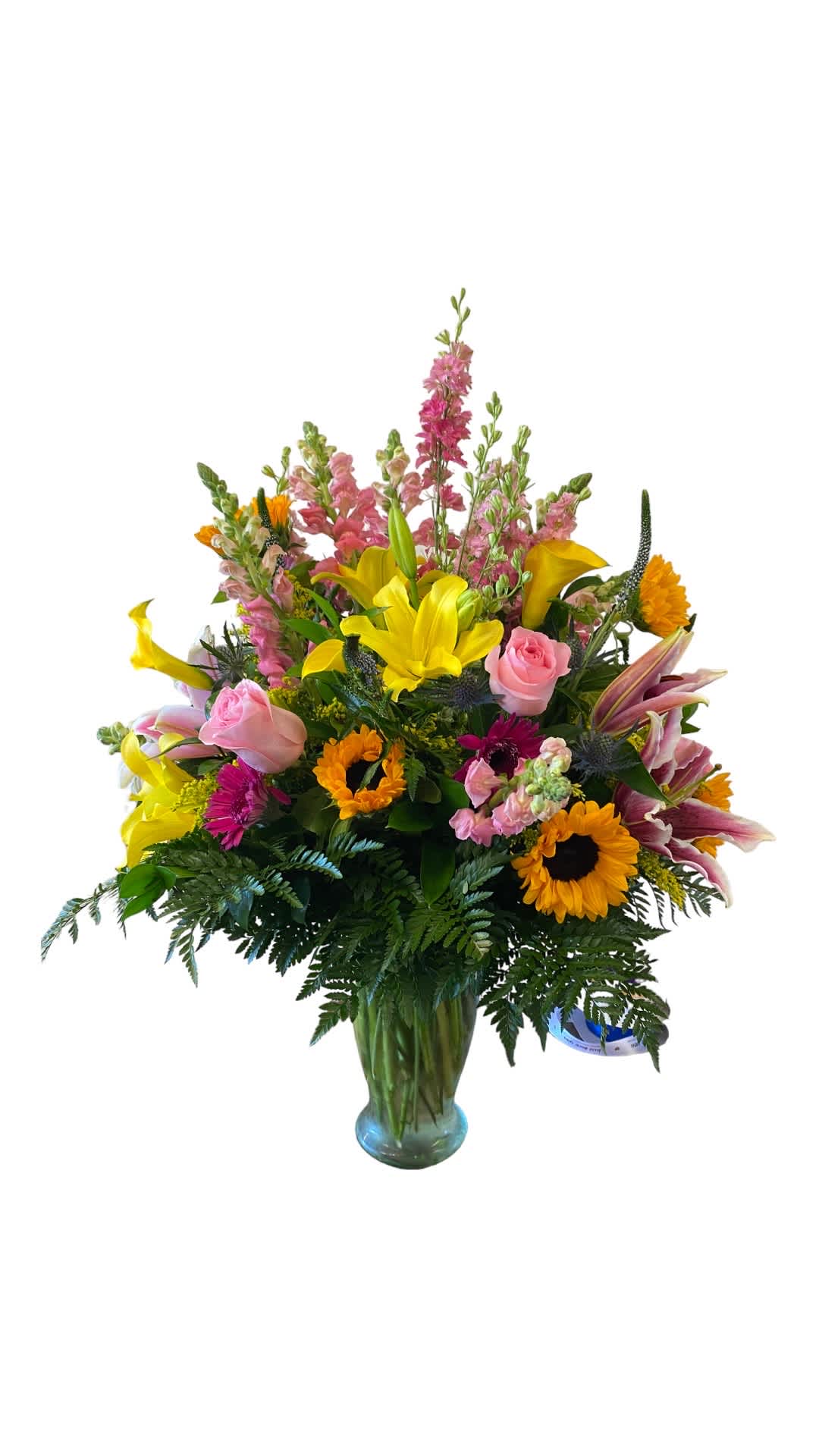 Spring Essence Spring Essence - Sunflowers, Pink Roses, Gerbera, Calla Lilies, Snap Dragons, Asiatic Lilies with Greenery.