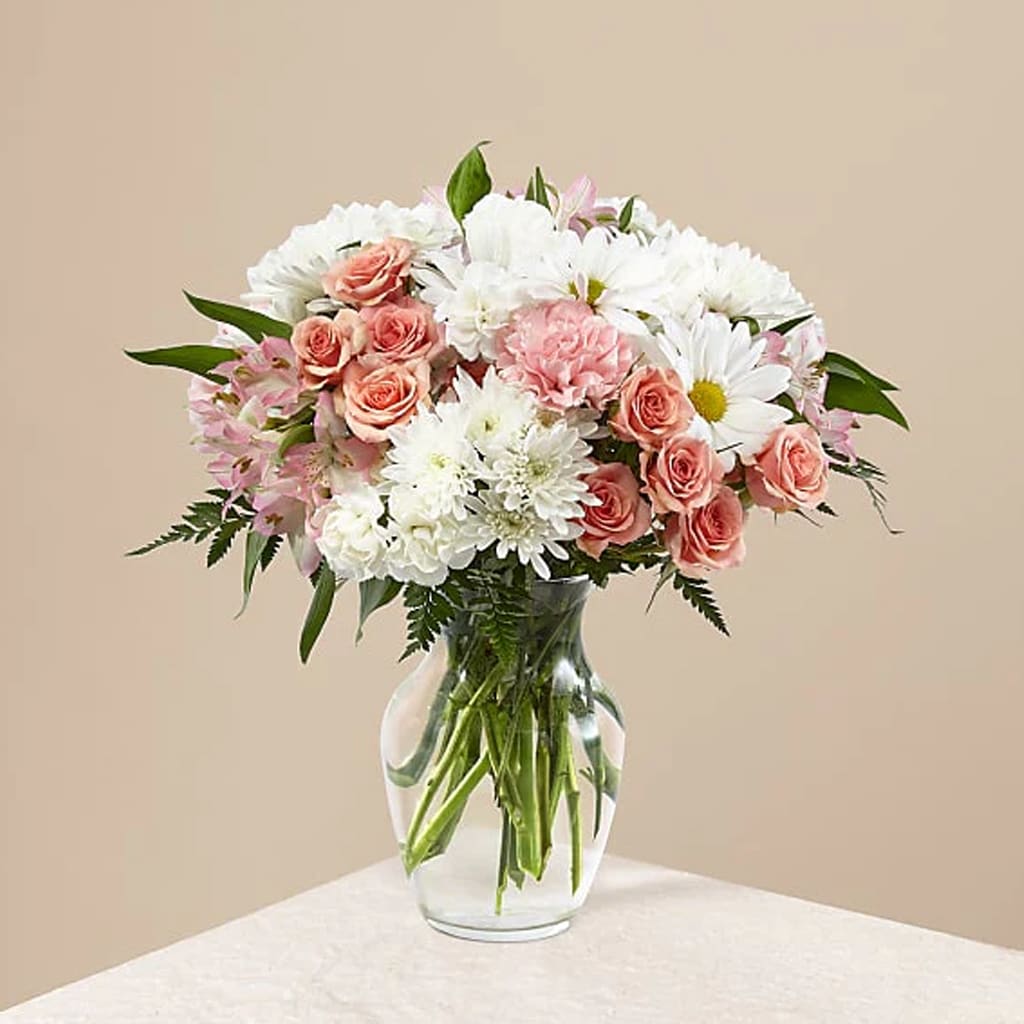 Blush Crush Blooms - It's just, a little blush! Crisp white roses and chrysanthemums are delicately arranged, accented by soft pink carnations, creating a timeless display.  Whoever you're sending this bouquet to, your loved ones are sure to crush hard on these gorgeous pink and white shades.  Approximately 16&quot;H x 15&quot; W. 