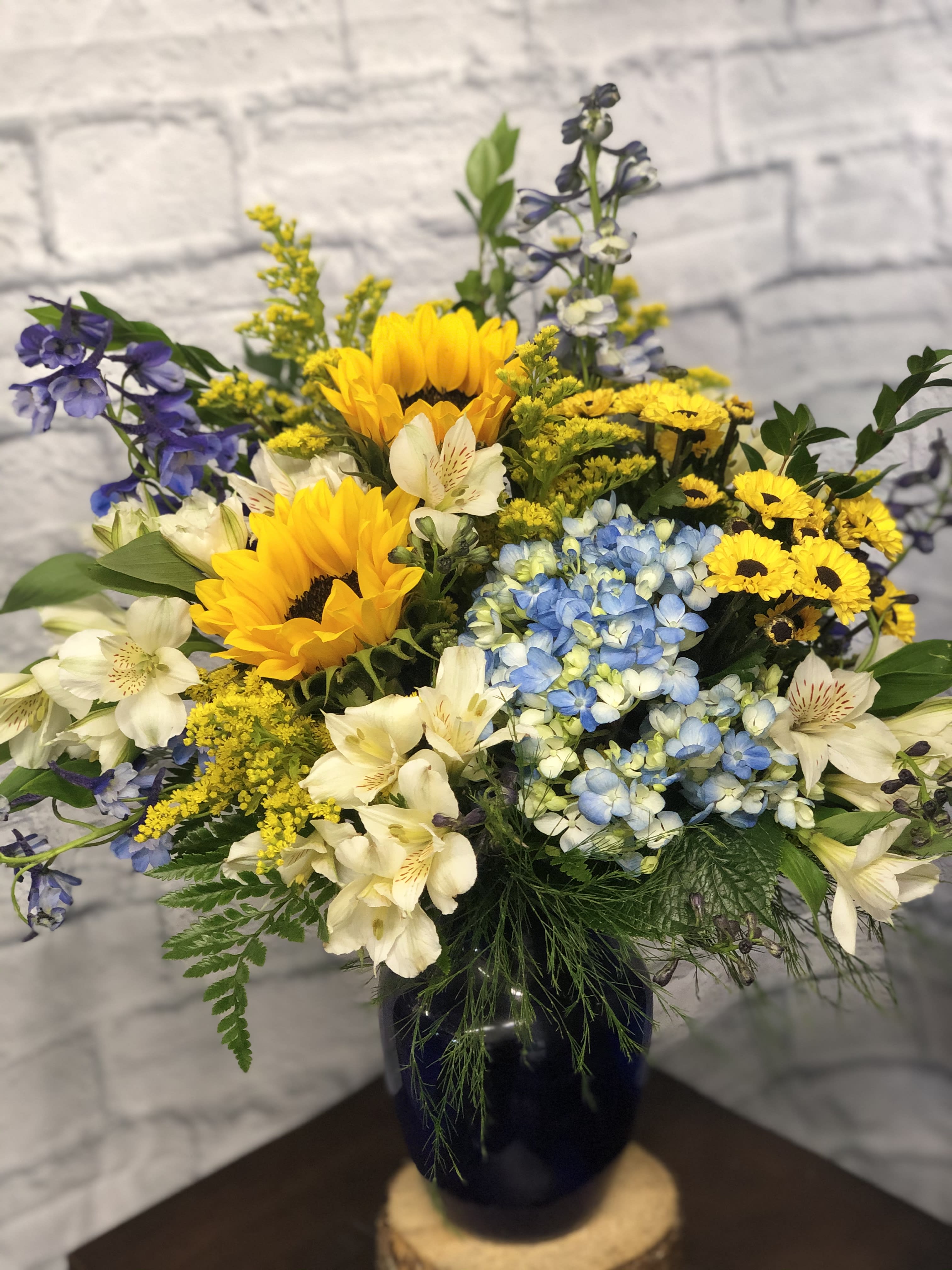Sunflower Delight - For the wildflower sunflower lover! They’ll adore the rustic look of this arrangement designed by our lead designer at La Pine Florist