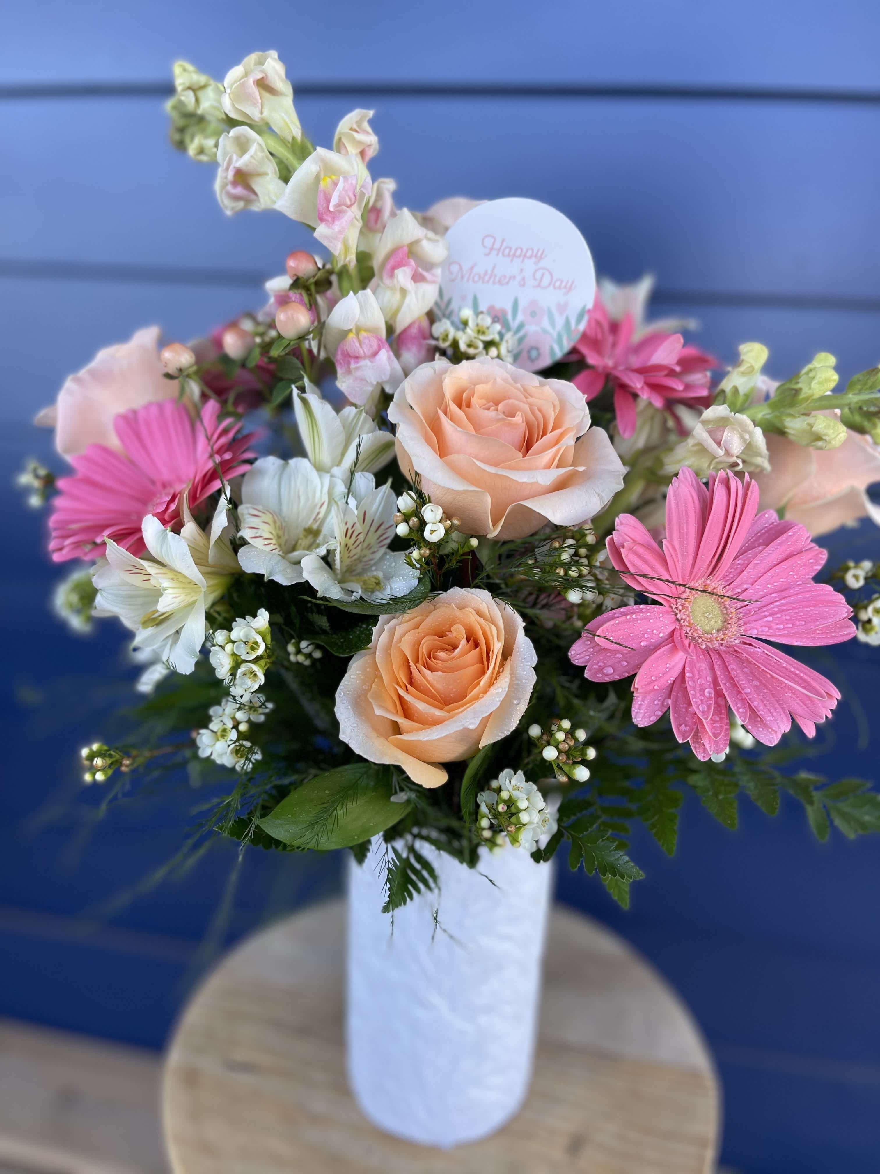 Peaches and Cream Peaches and Cream - A beautiful peachy pink arrangement in a keepsake white embossed vase